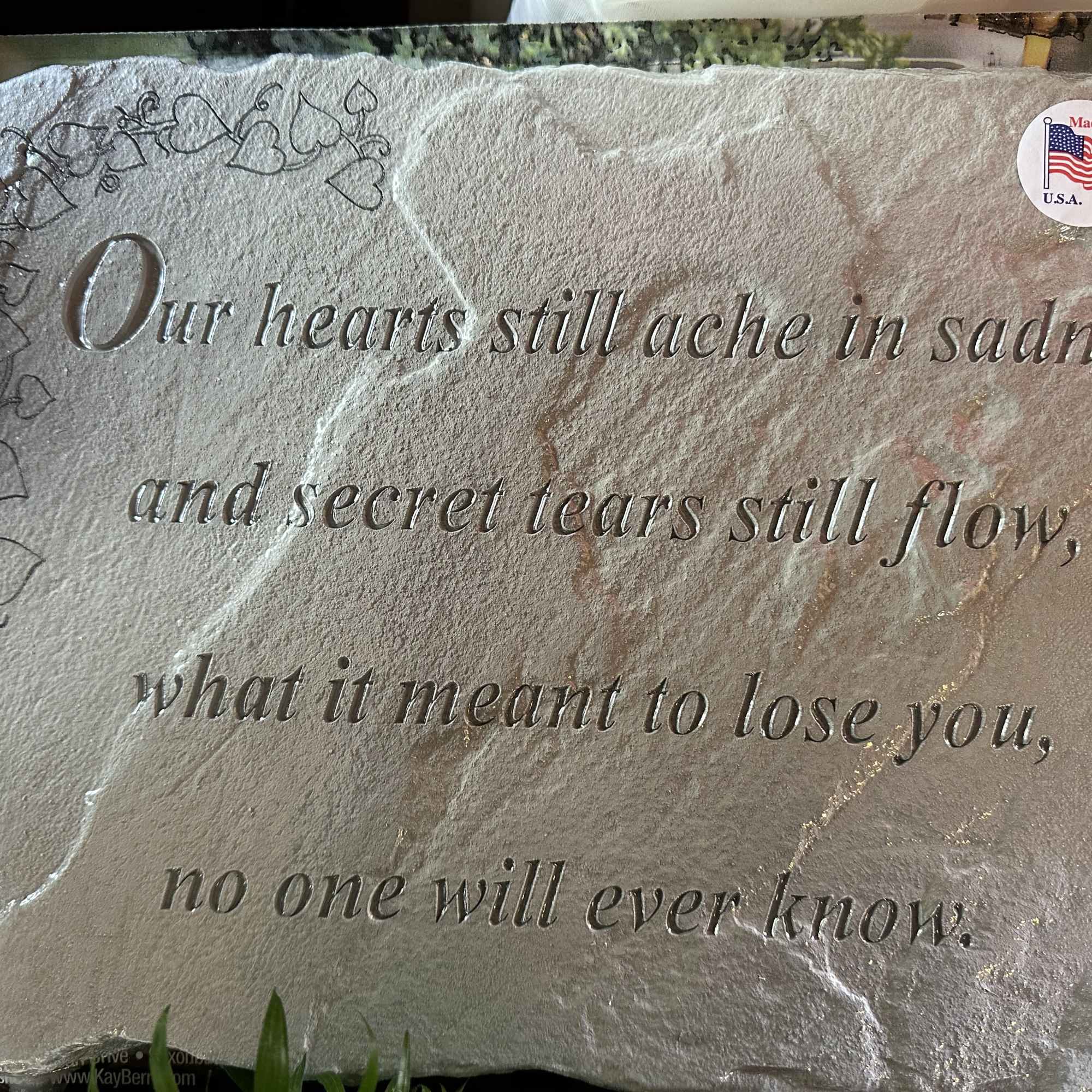 Memorial plaque with an engraved sympathy poem and heart border