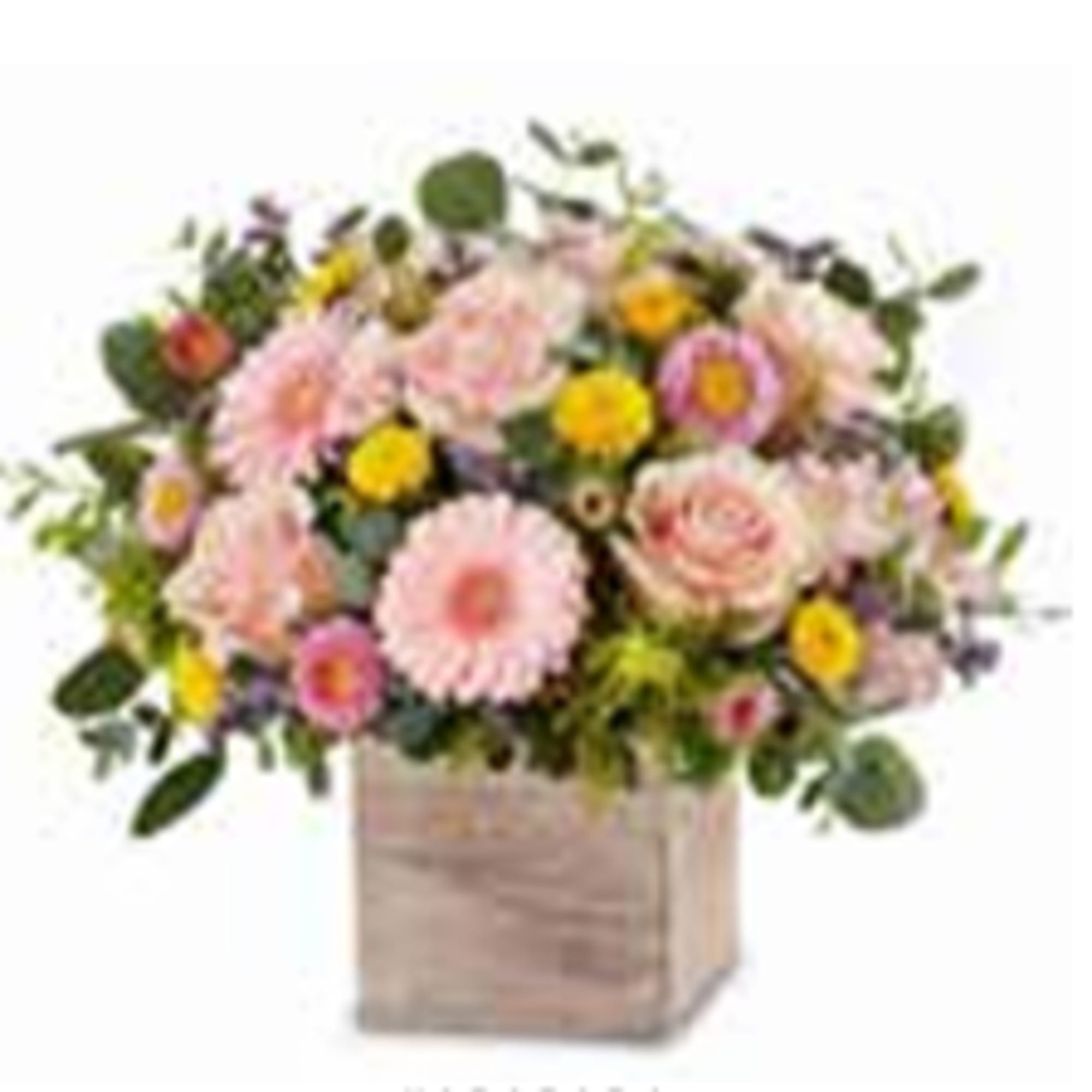 Pink and yellow mixed flower arrangement in a square wooden box