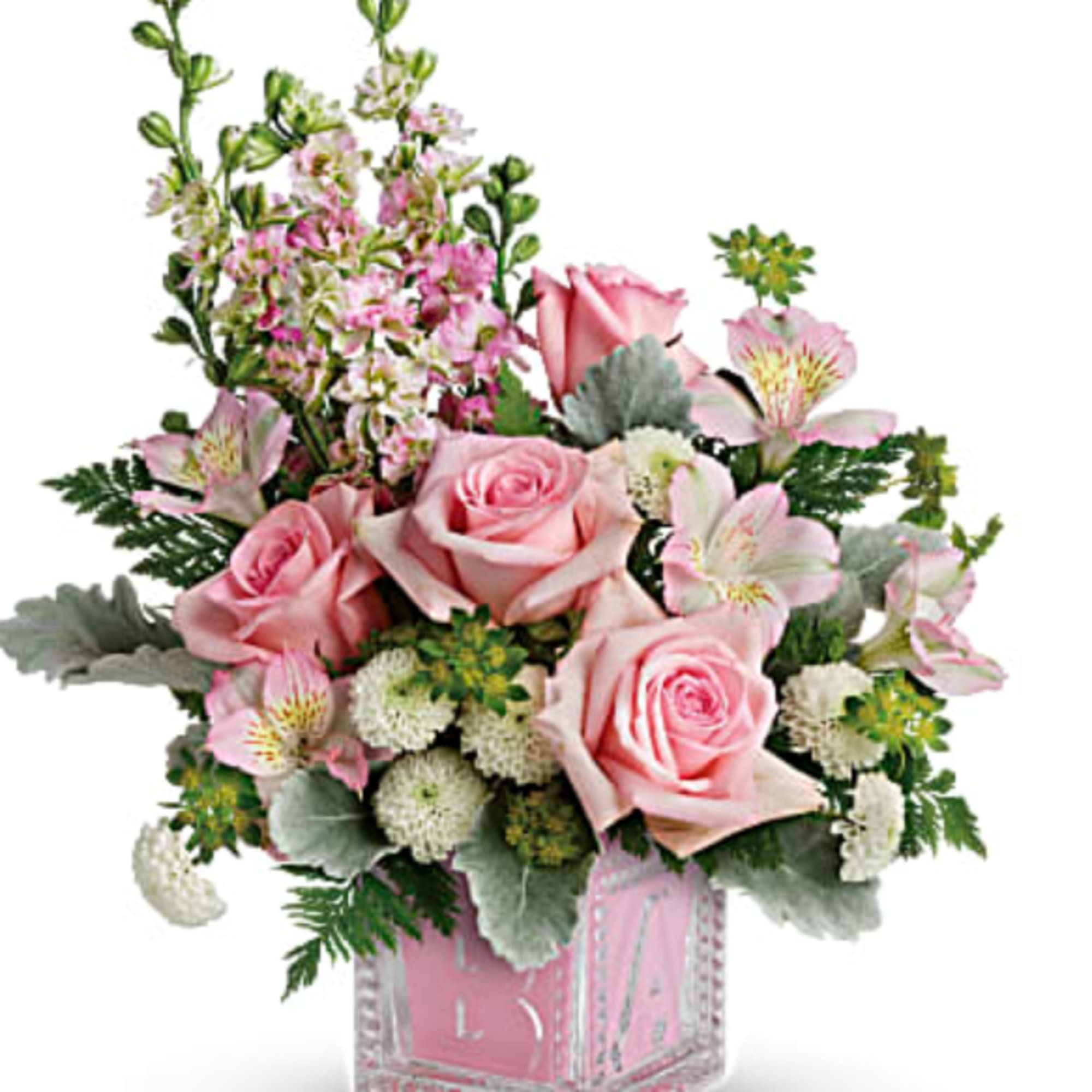 Pink roses and alstroemeria in a pink glass vase
