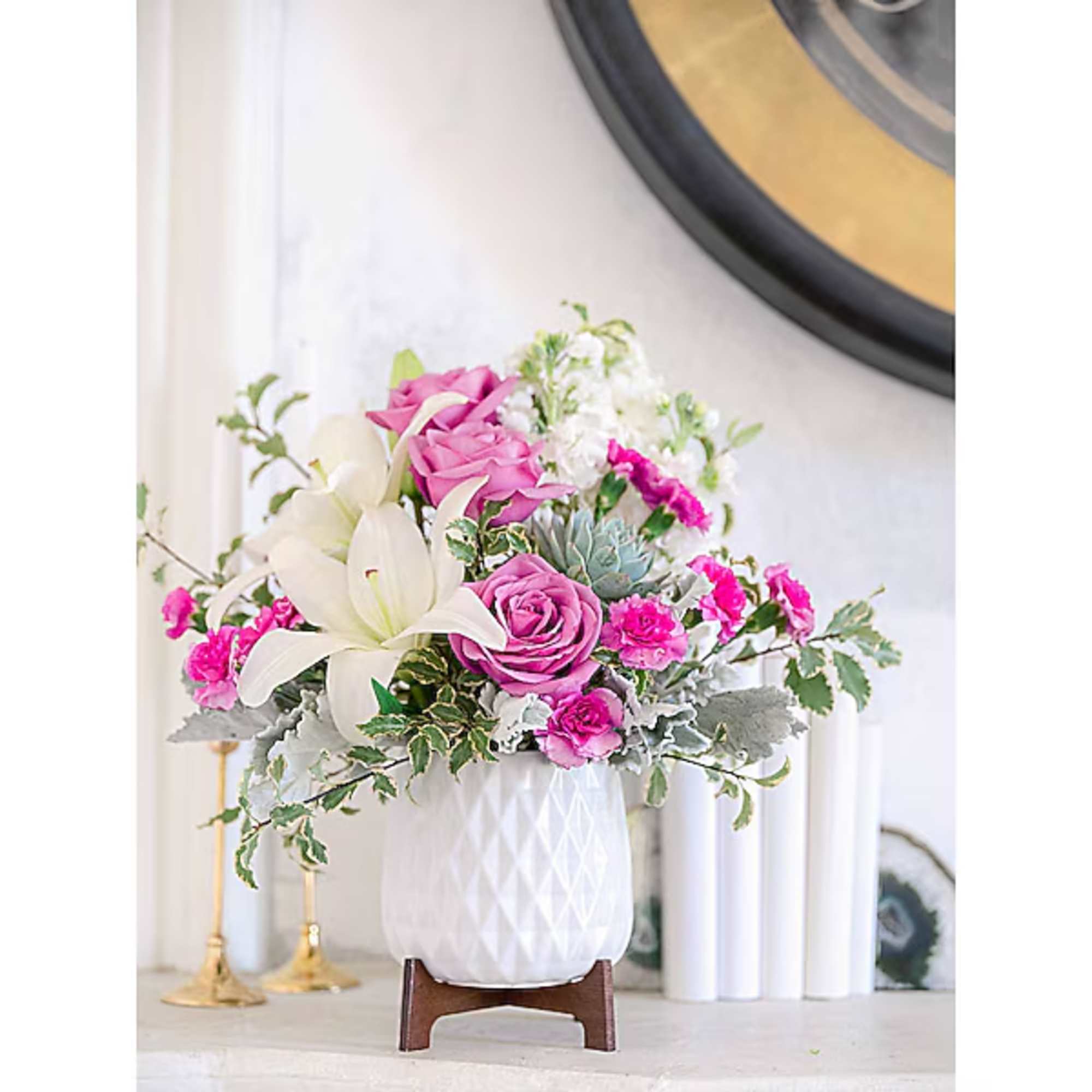 Pink and white floral arrangement in a white vase