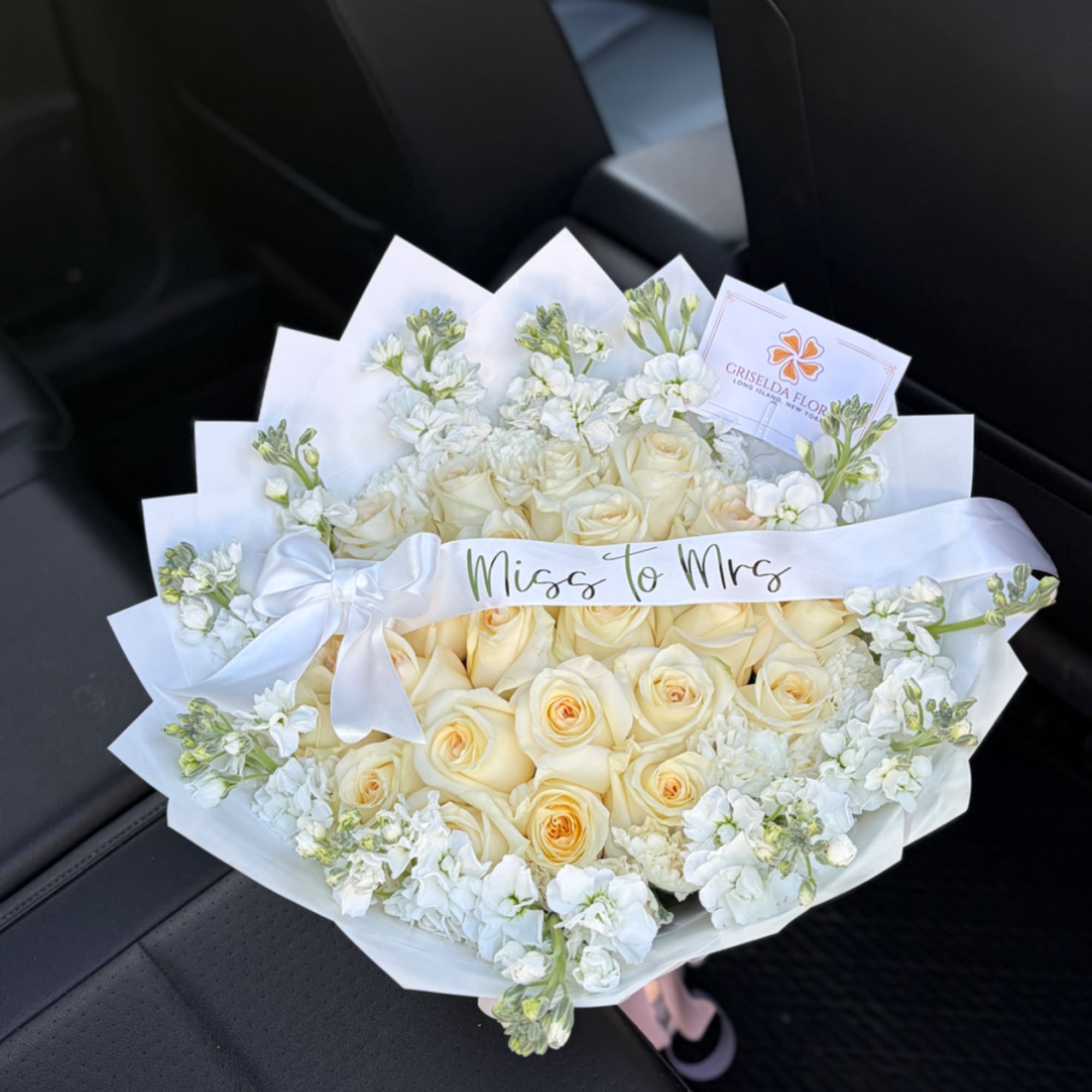 Cream rose bouquet with white flowers and a satin ribbon reading "Miss to Mrs", photo 3 of 4