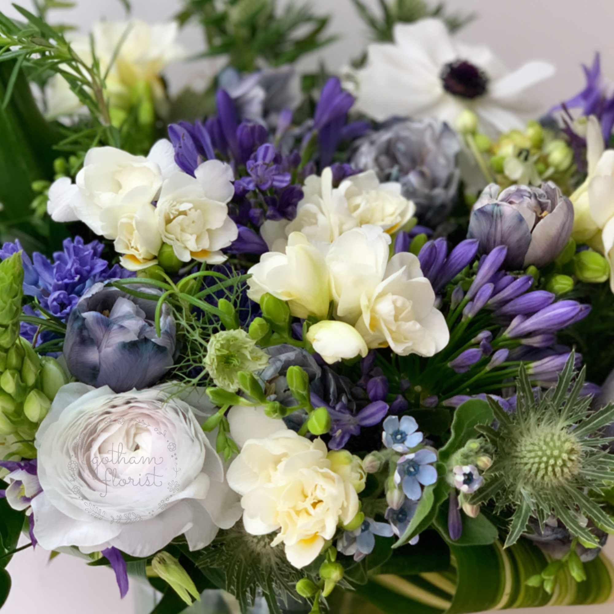 Bouquet of white and purple flowers in a glass vase