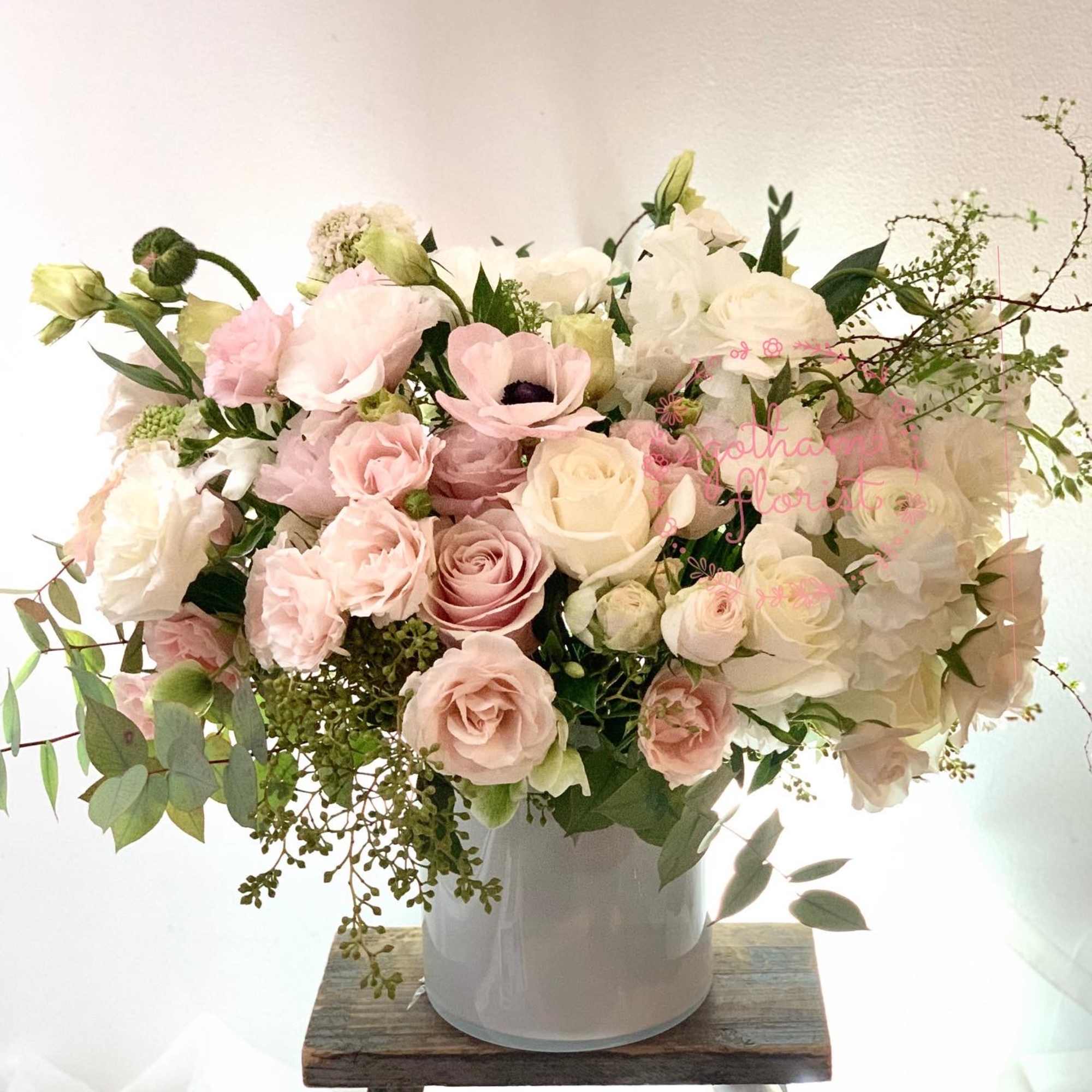 Blush and white rose bouquet in a white vase, photo 2 of 2