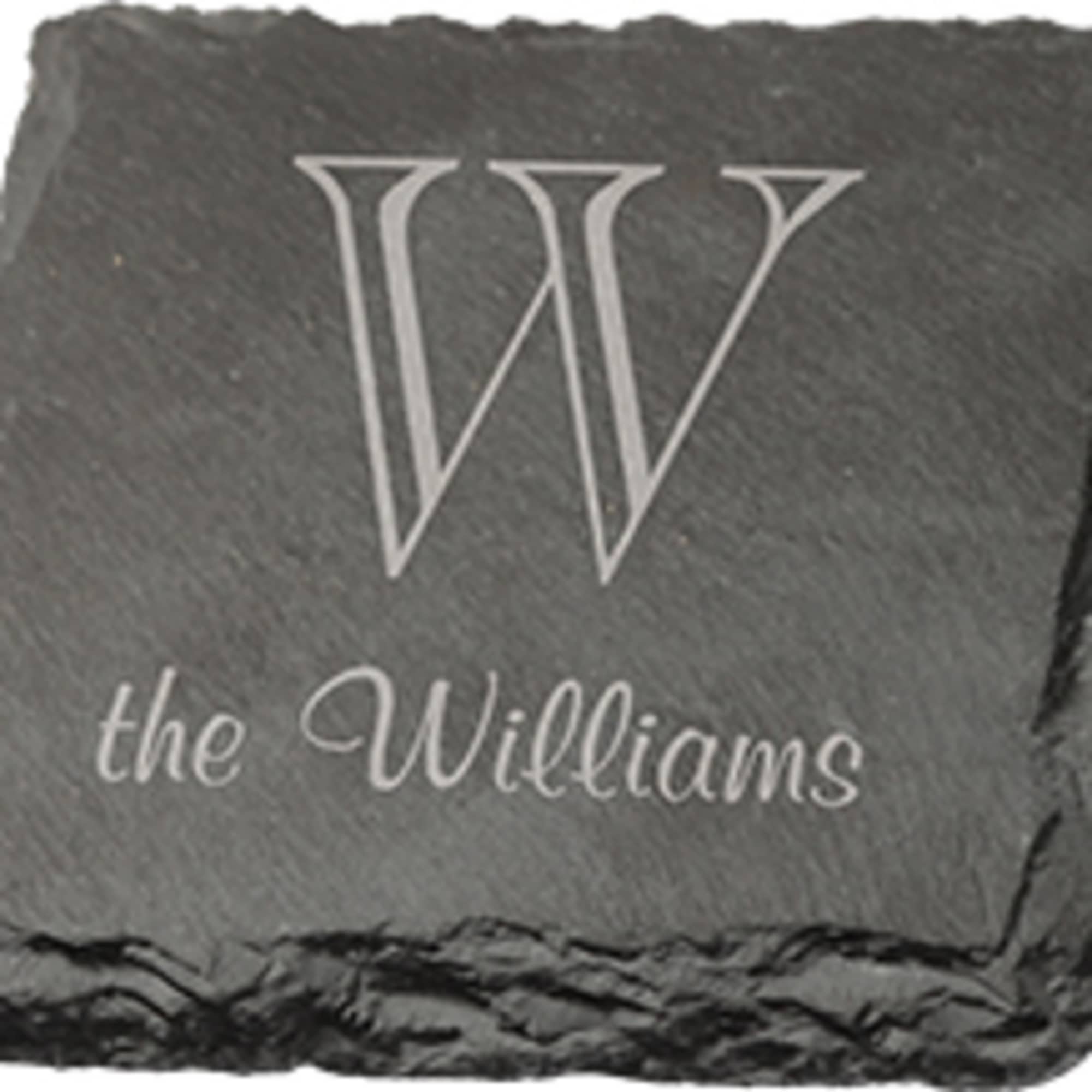 Engraved black slate coaster with a large W and the Williams name