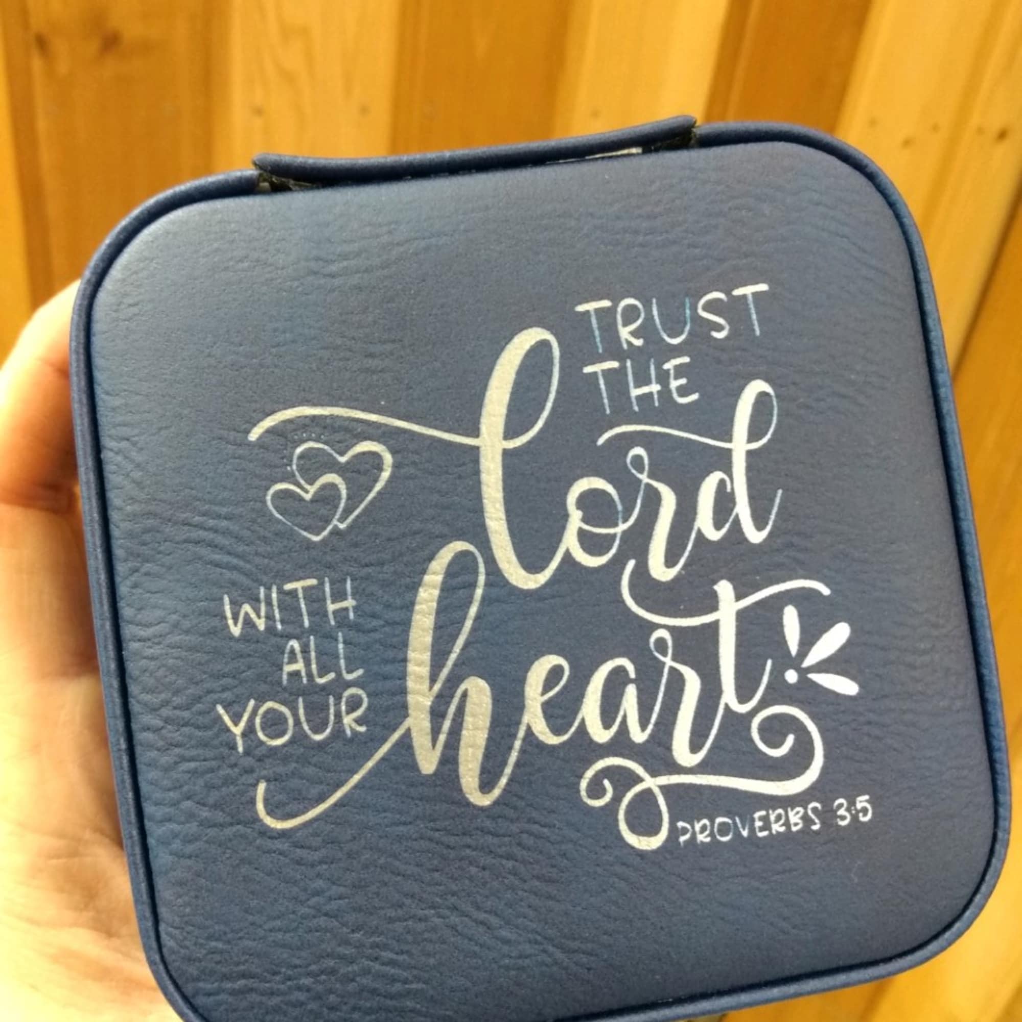 Blue zippered pouch with the words Trust the Lord with all your heart