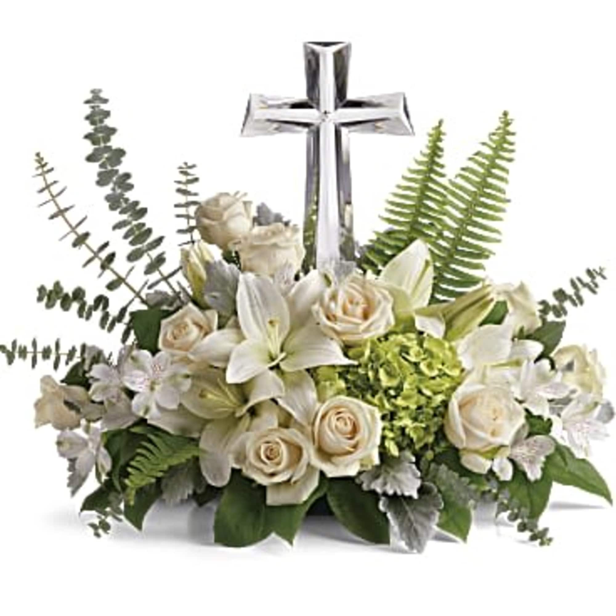 White floral arrangement with a silver cross centerpiece