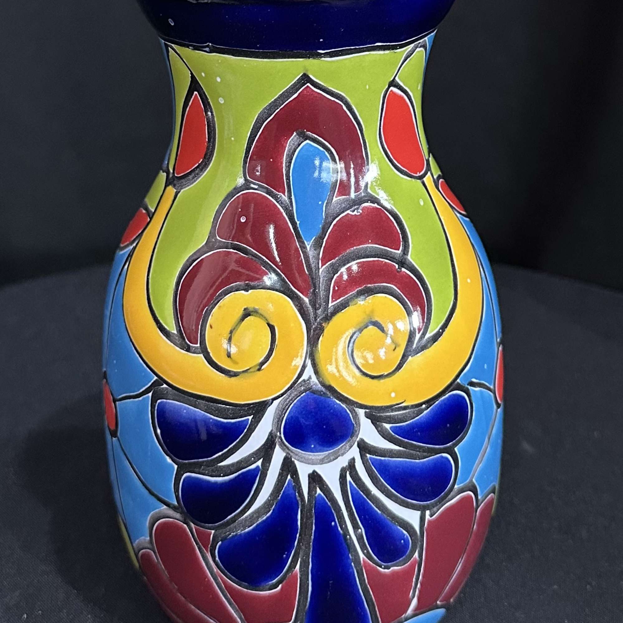 Colorful painted ceramic vase with a floral pattern
