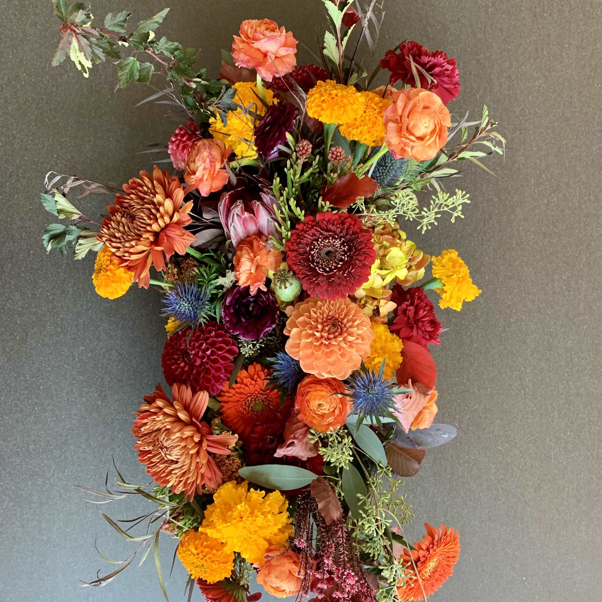 Colorful mixed bouquet with orange, red, and yellow flowers