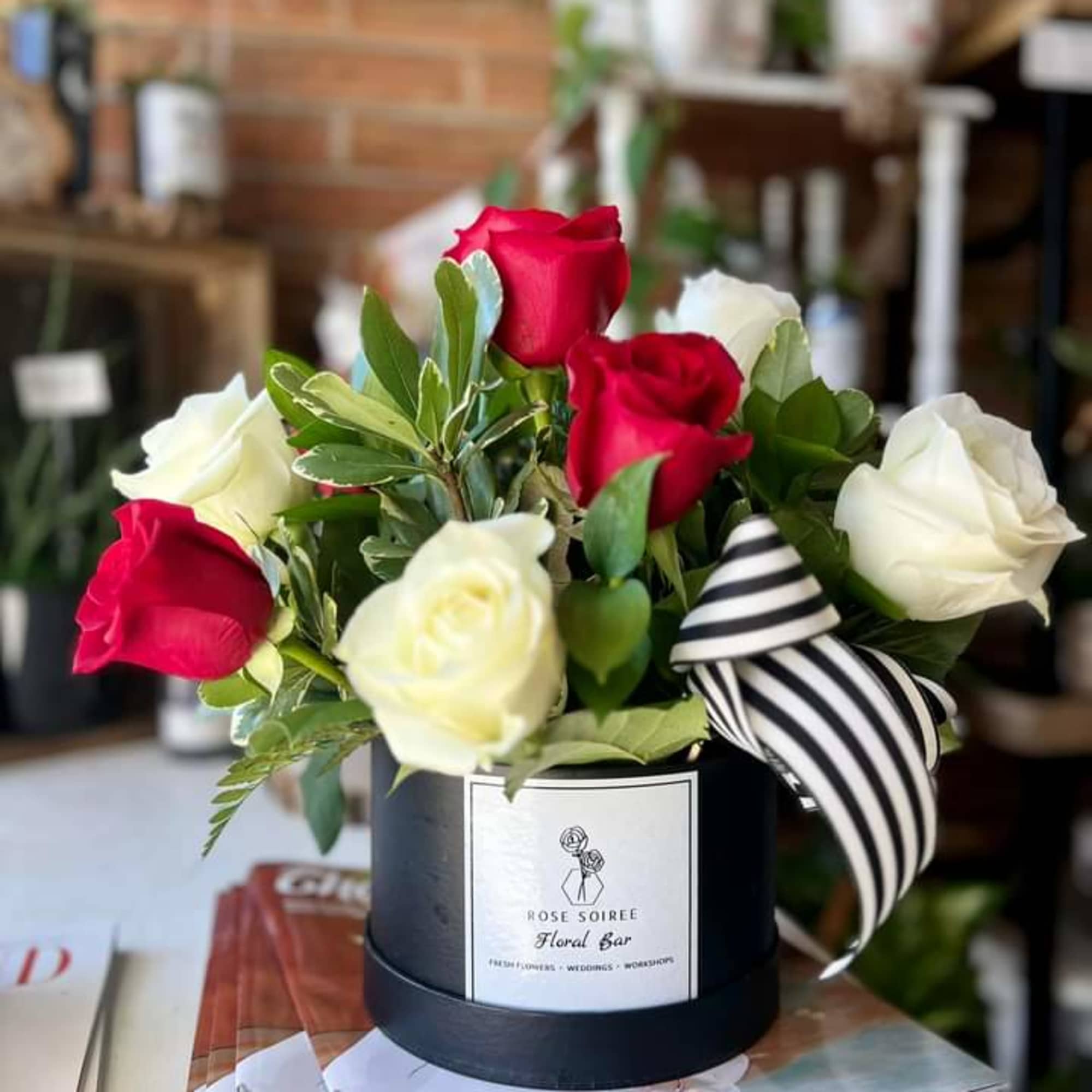Gorgeous is an understatement! A traditional red and white rose arrangement in, photo 2 of 2