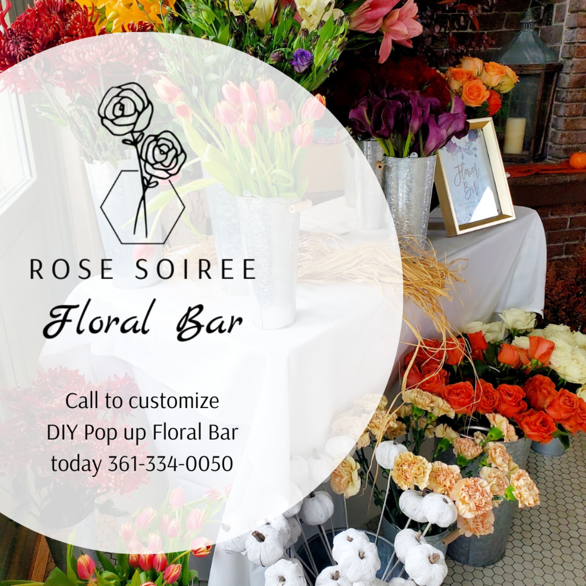 Floral bar display with buckets of roses, tulips, and calla lilies