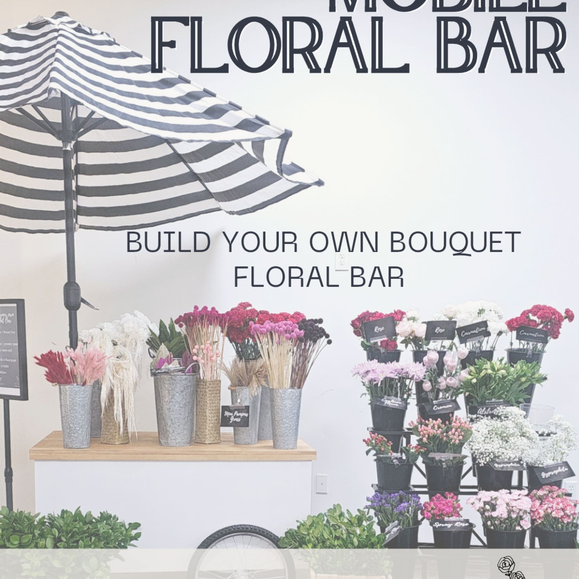 Mobile floral bar display with assorted flowers in buckets under a striped umbrella
