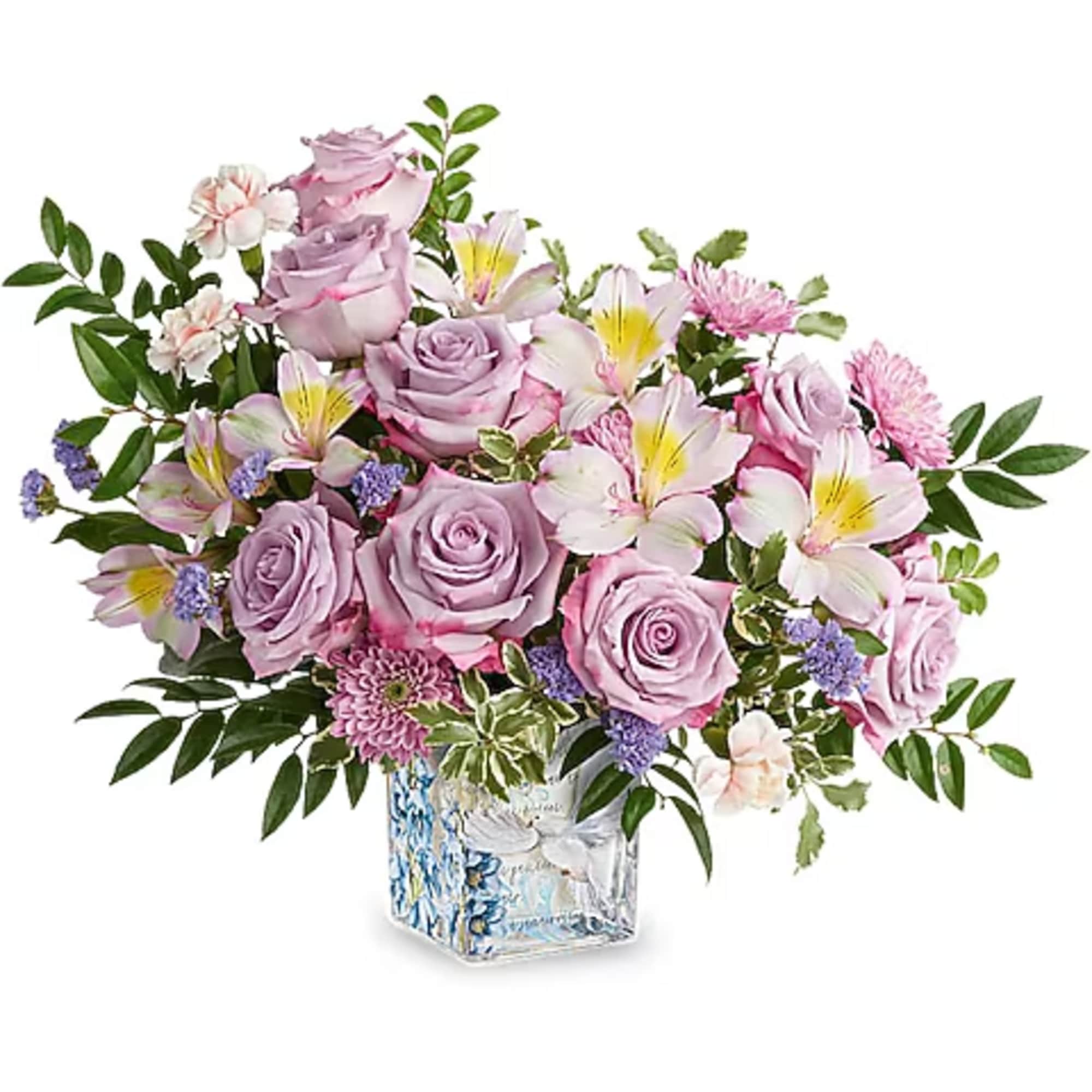 Lavender roses and pink lilies in a square glass vase