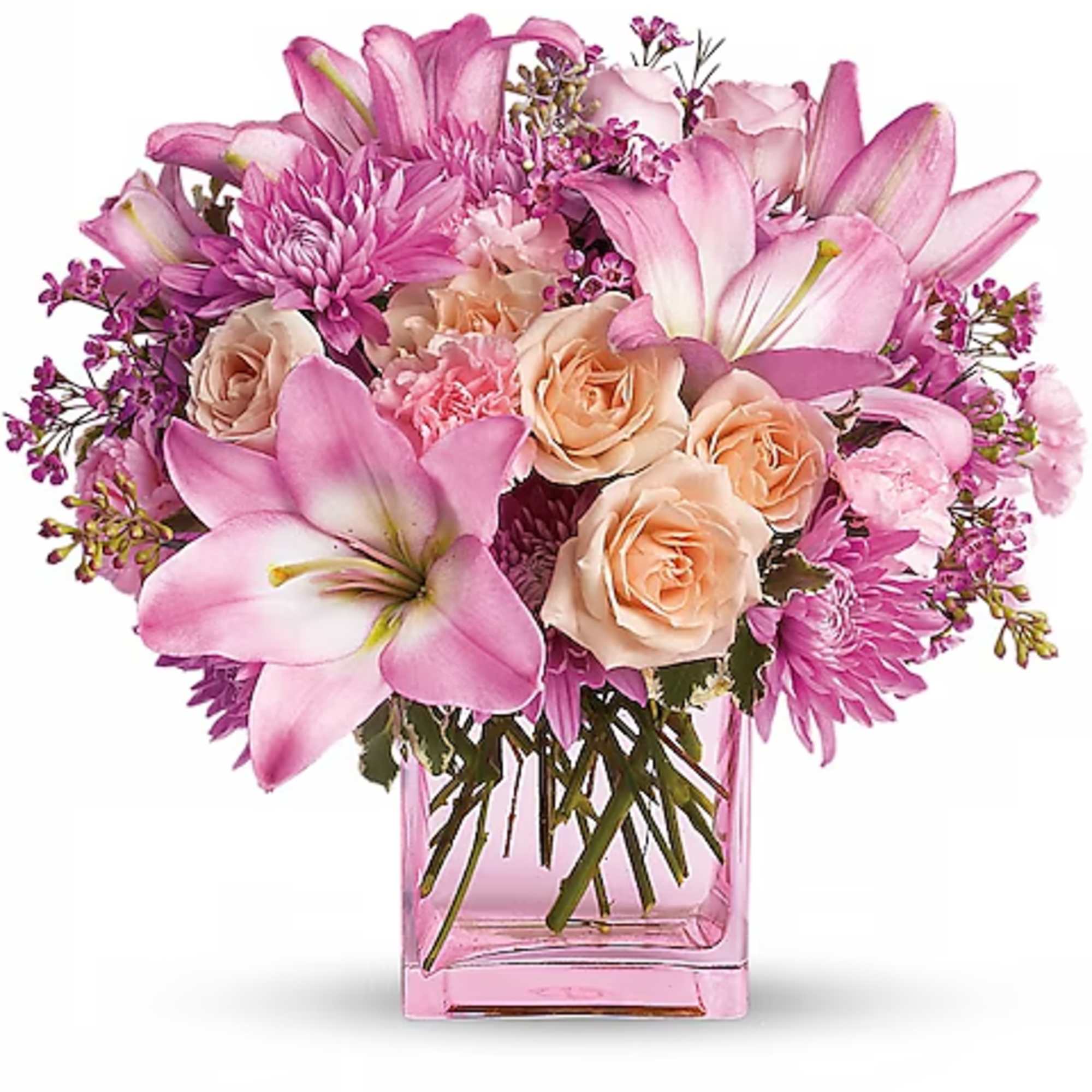 Pink lilies, roses, and chrysanthemums in a pink glass vase