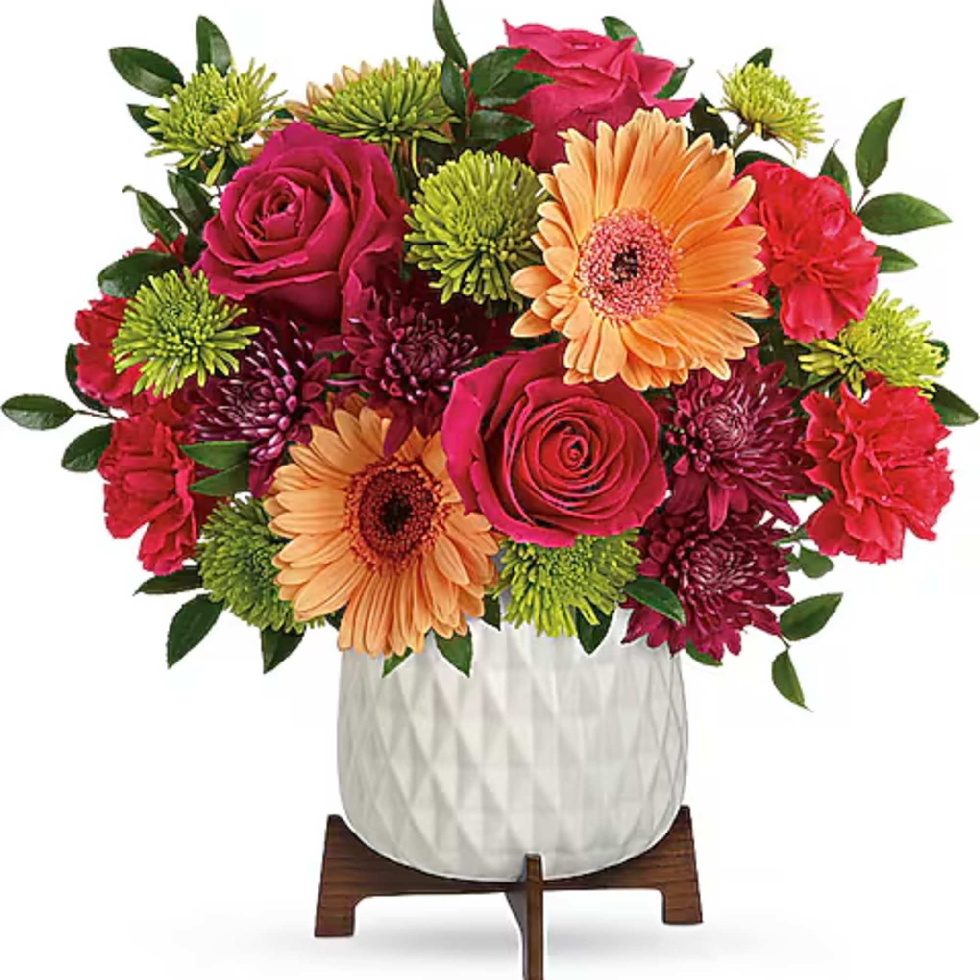 Mixed bouquet of pink roses, gerbera daisies, and chrysanthemums in a white vase