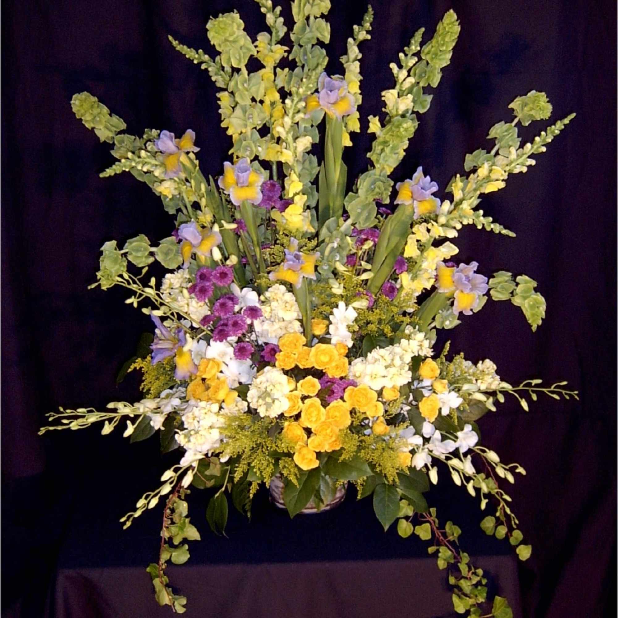 Tall and full assortment of seasonal premium flowers.  Assortment and colors