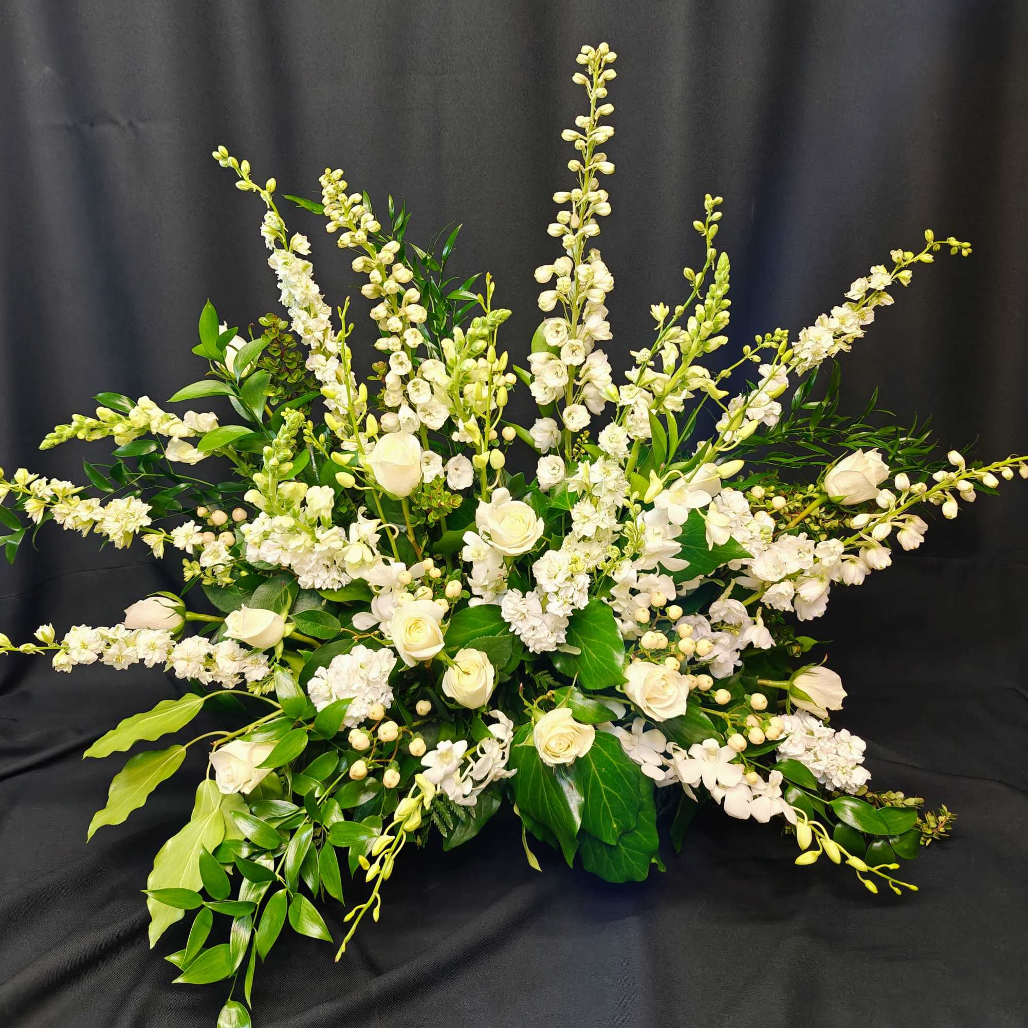 Pure white flowers and lush foliage in a paper mache pot. This, photo 2 of 4
