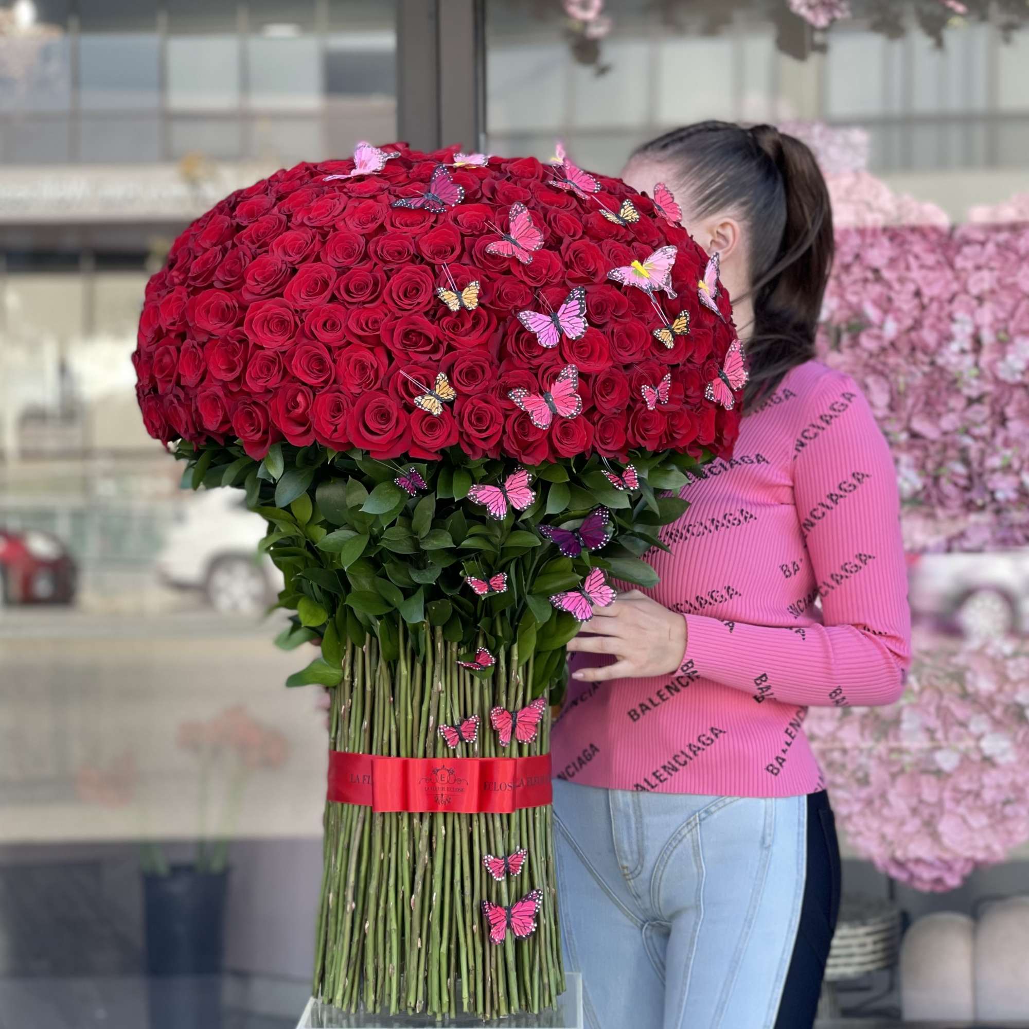 Large bouquet of red roses with butterfly decorations