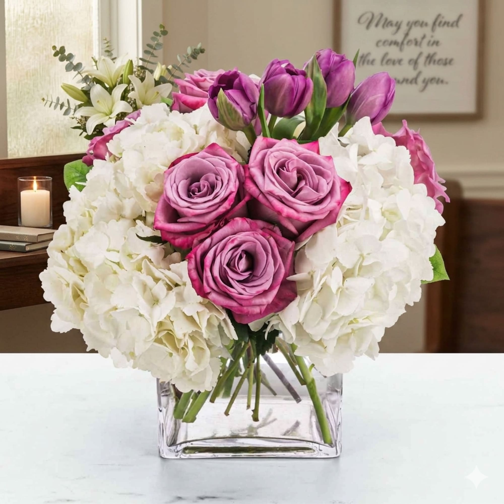 A cloud of soft white hydrangeas creates the serene foundation of this