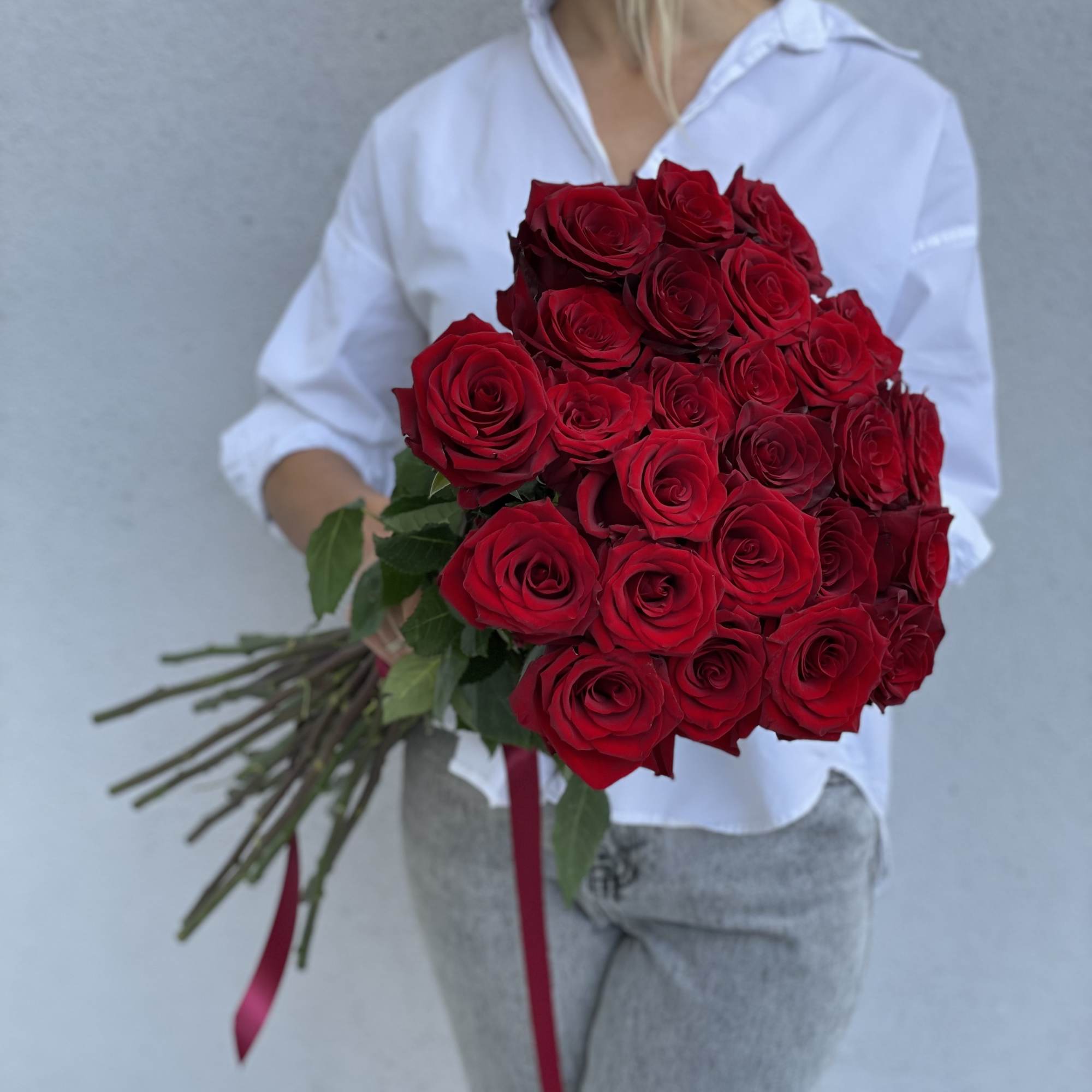Large bouquet of red roses tied with a ribbon