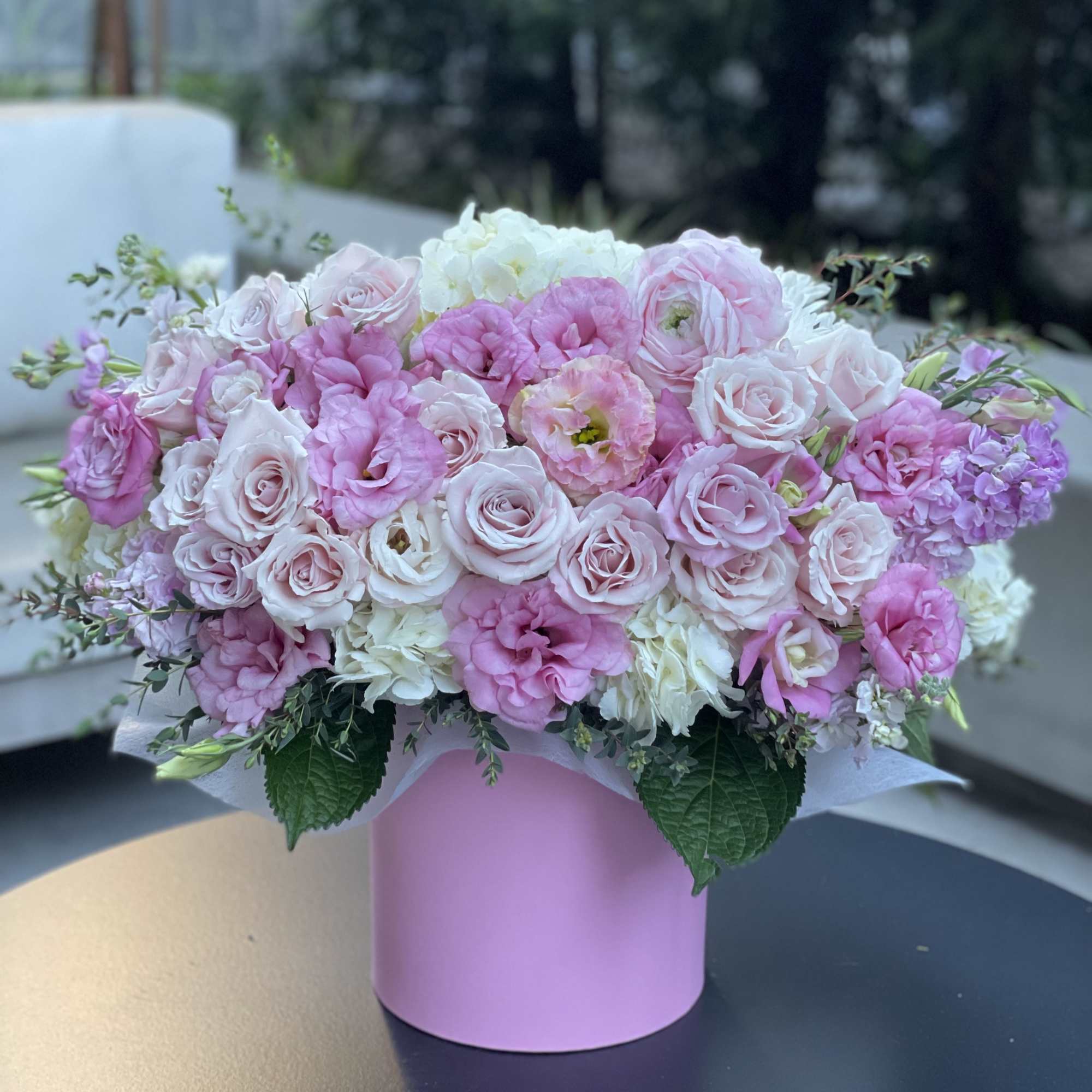 Pink and white rose bouquet in a pastel pink box