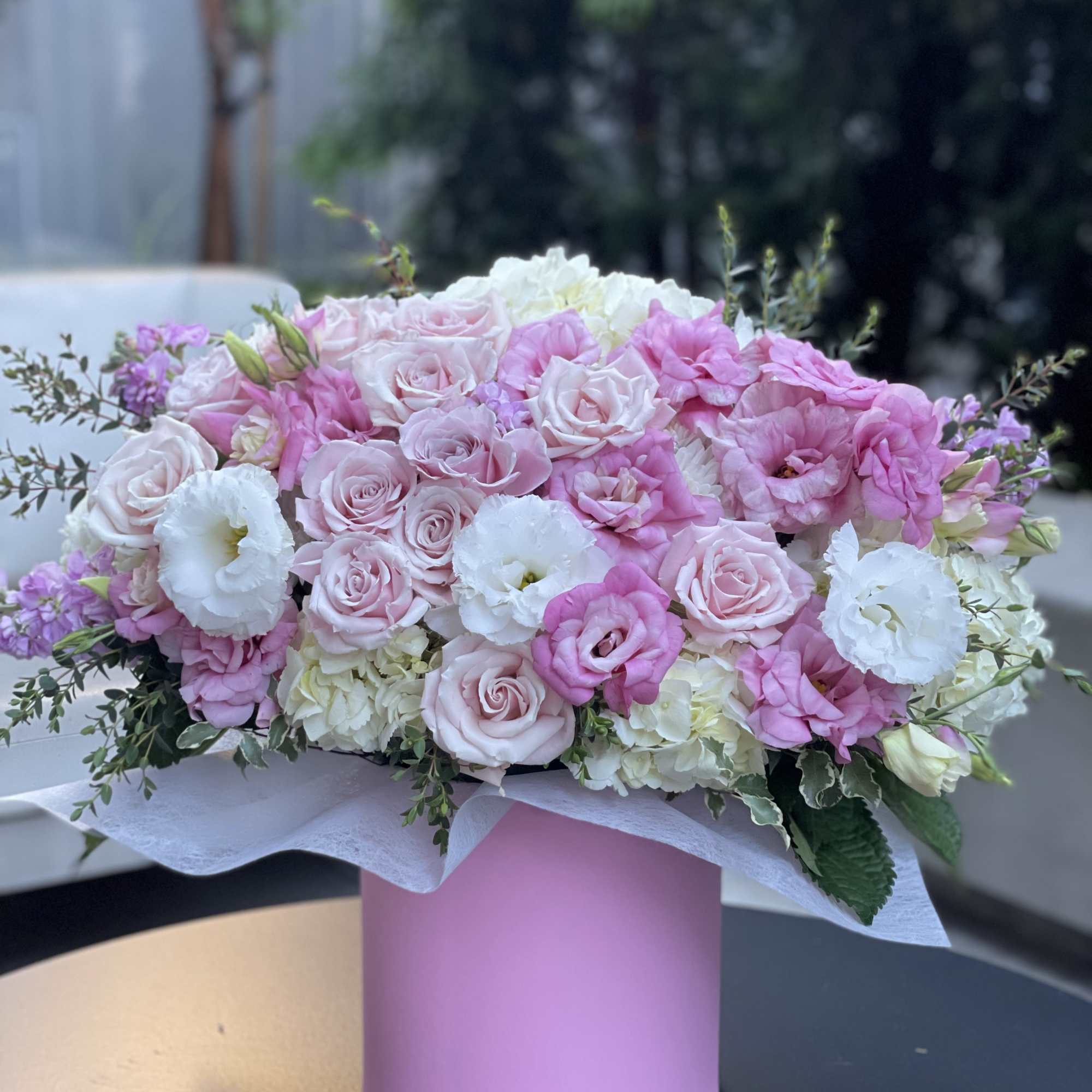 Pink and white rose bouquet in a pink box