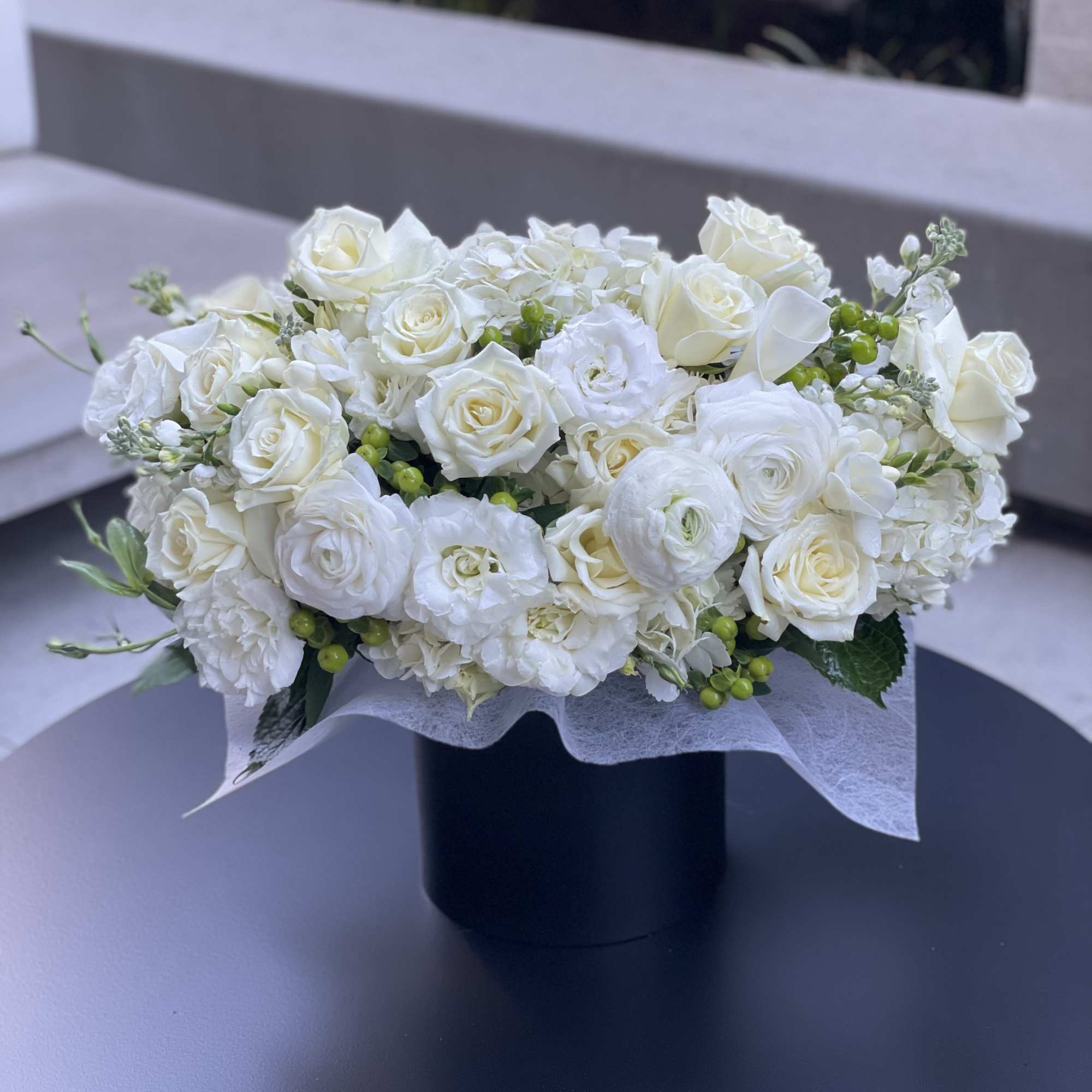 White rose and ranunculus arrangement in a black box, photo 2 of 5