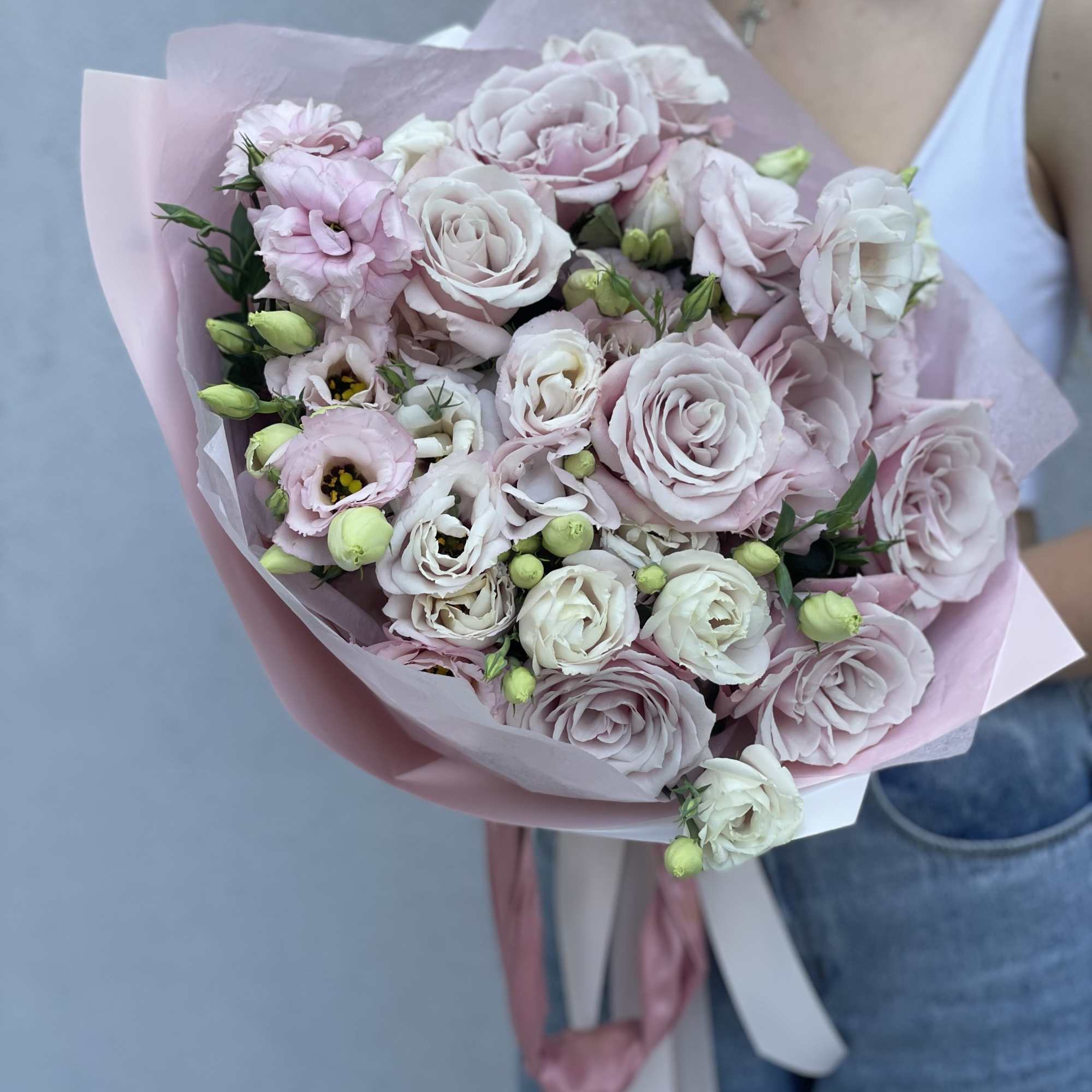 Bouquet of pale pink and white roses wrapped in pink paper, photo 4 of 10