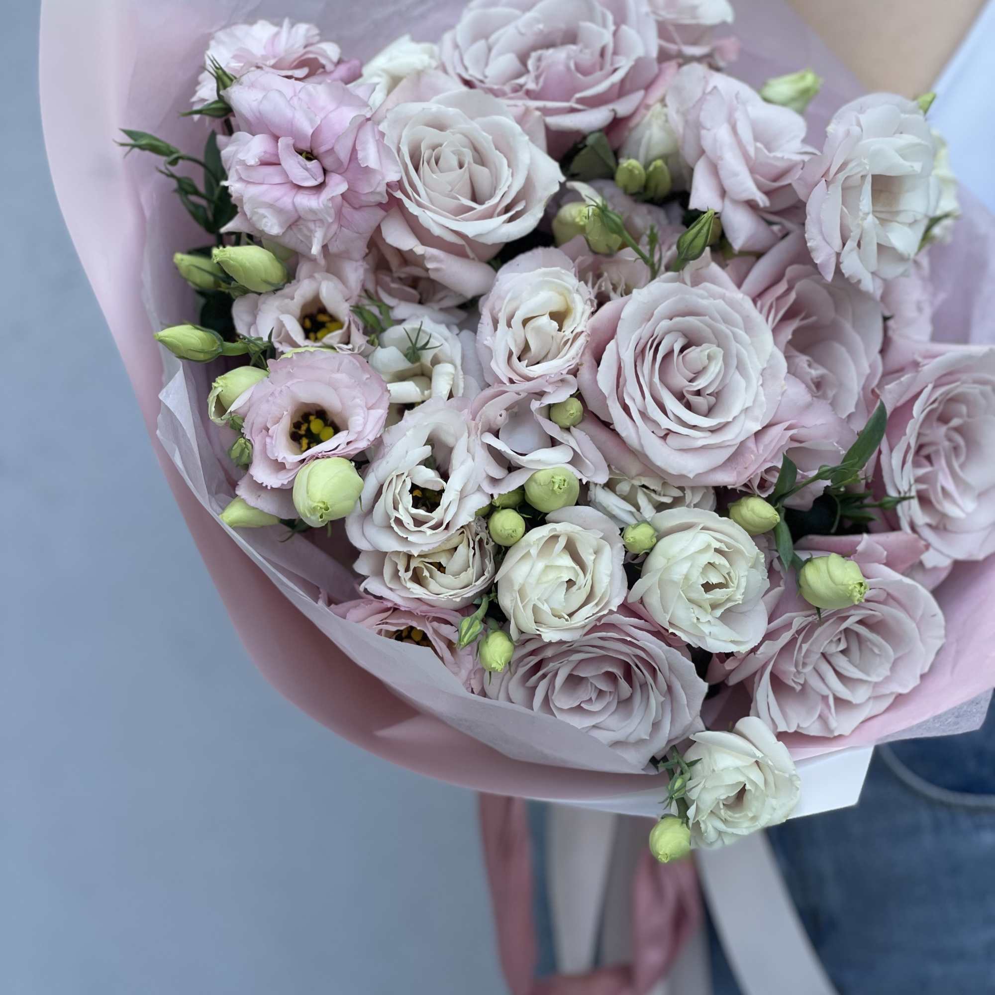 Bouquet of pale pink and white roses wrapped in pink paper, photo 6 of 10