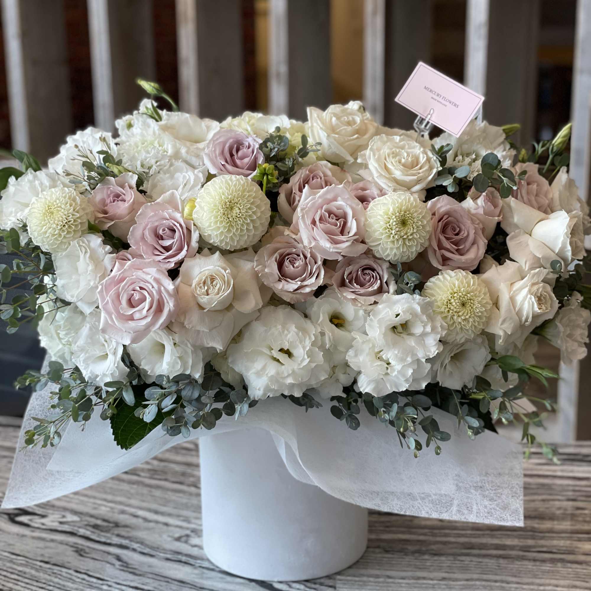 Blush and white rose bouquet in a white hat box