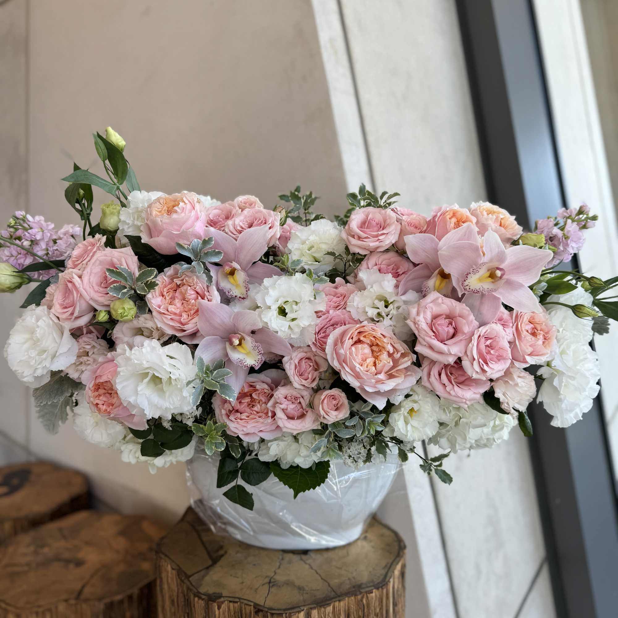 Pink and white floral arrangement in a white vase, photo 4 of 4