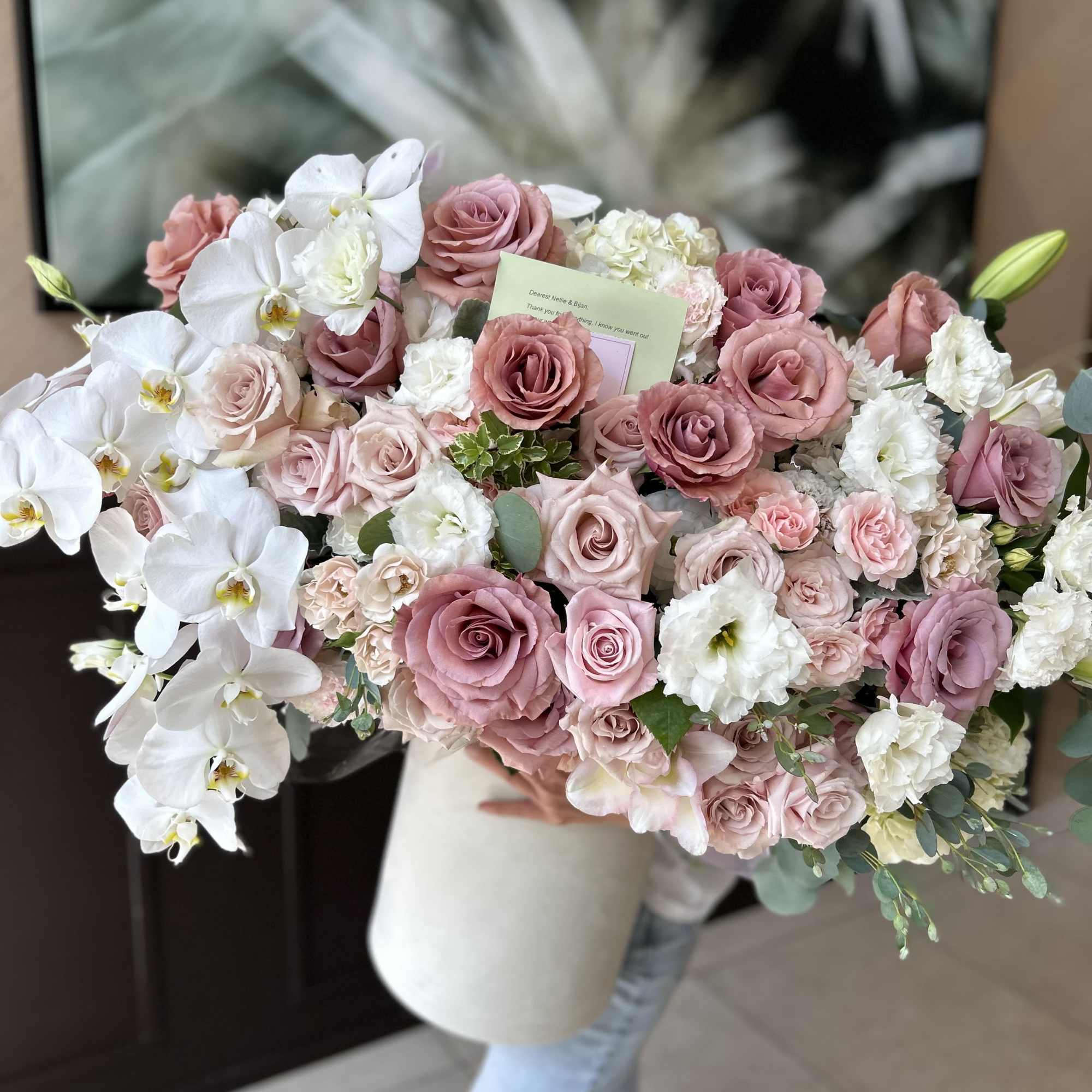 Large bouquet of pink roses and white orchids