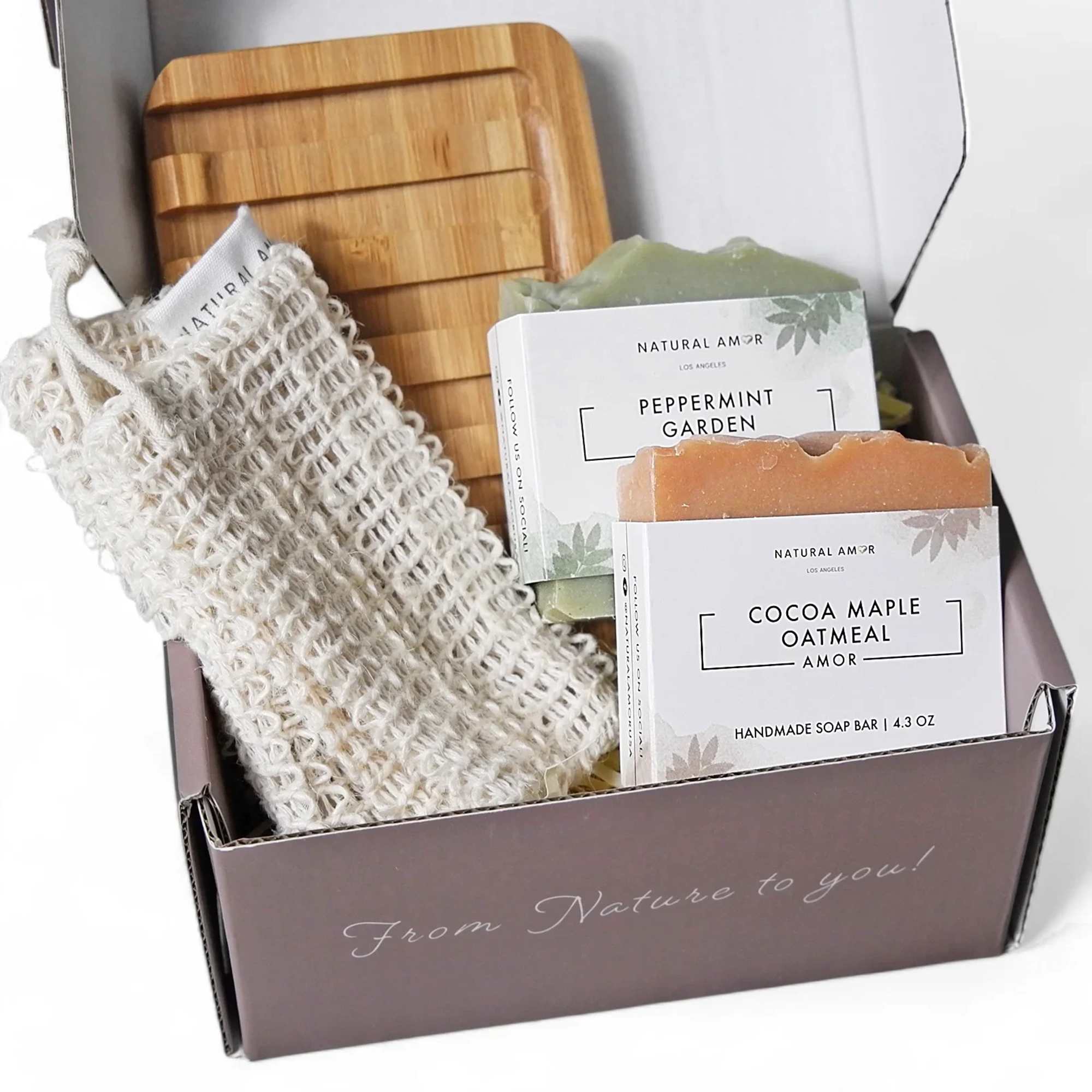 Gift box with handmade soap bars, a wooden tray, and a soap saver pouch