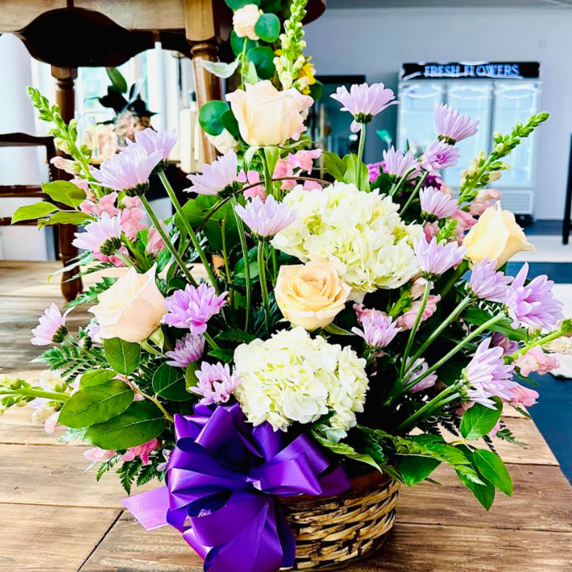 Beautiful collection of Daisies, Roses, Snapdragons, Hydrangeas and mixed greens in a