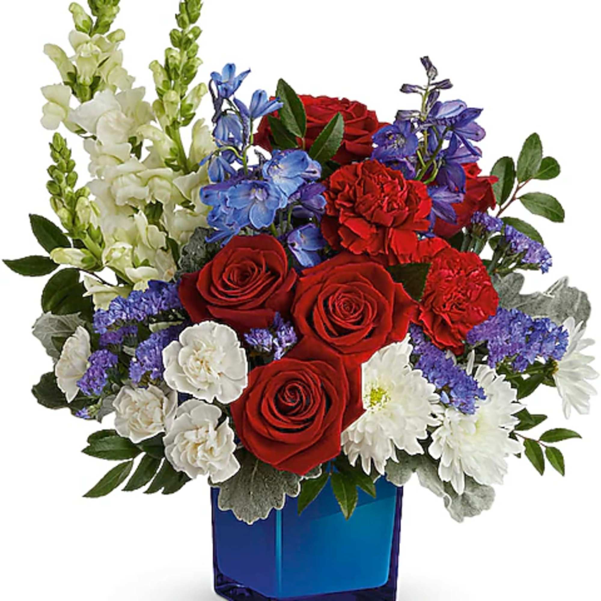 Red roses, white daisies, and blue flowers in a blue glass vase