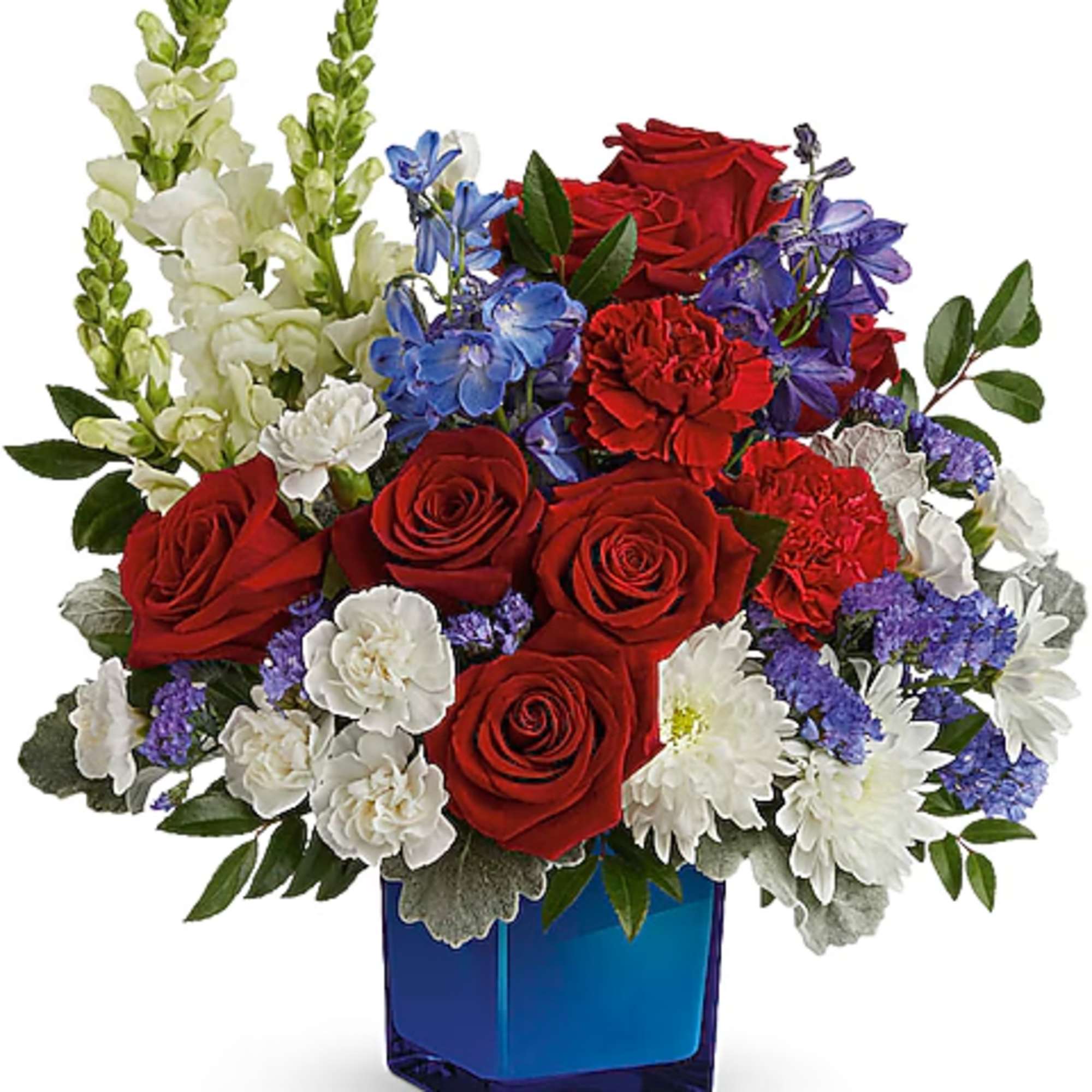 Red roses, white daisies, and blue flowers in a blue glass vase