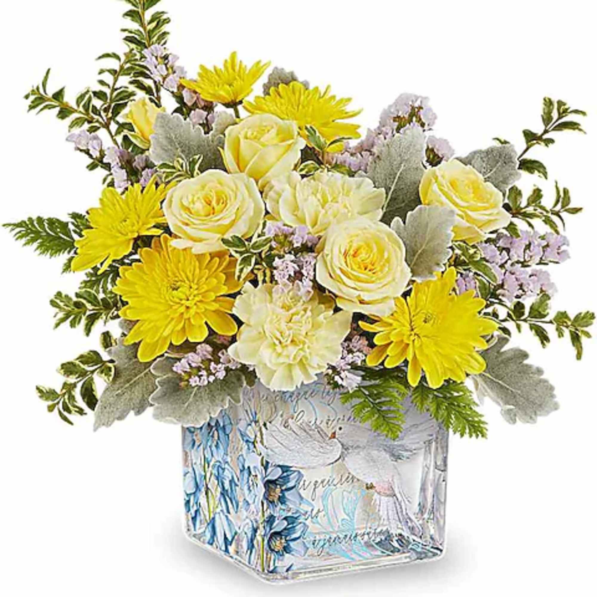 Yellow and cream bouquet in a decorative glass vase