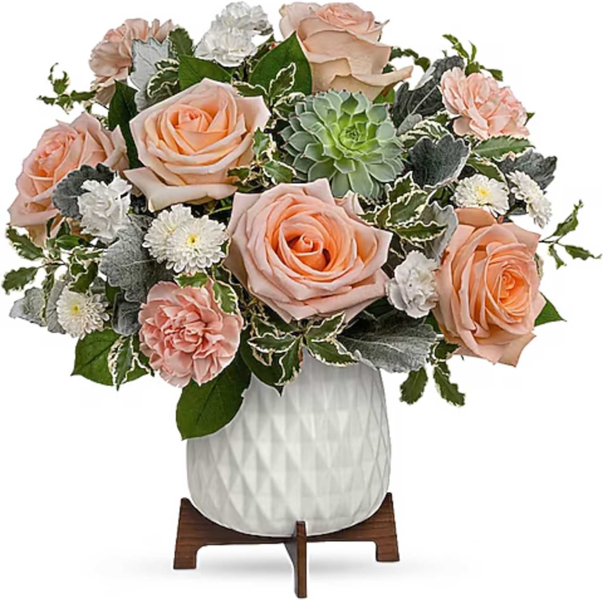 Peach roses and white daisies arranged in a white vase