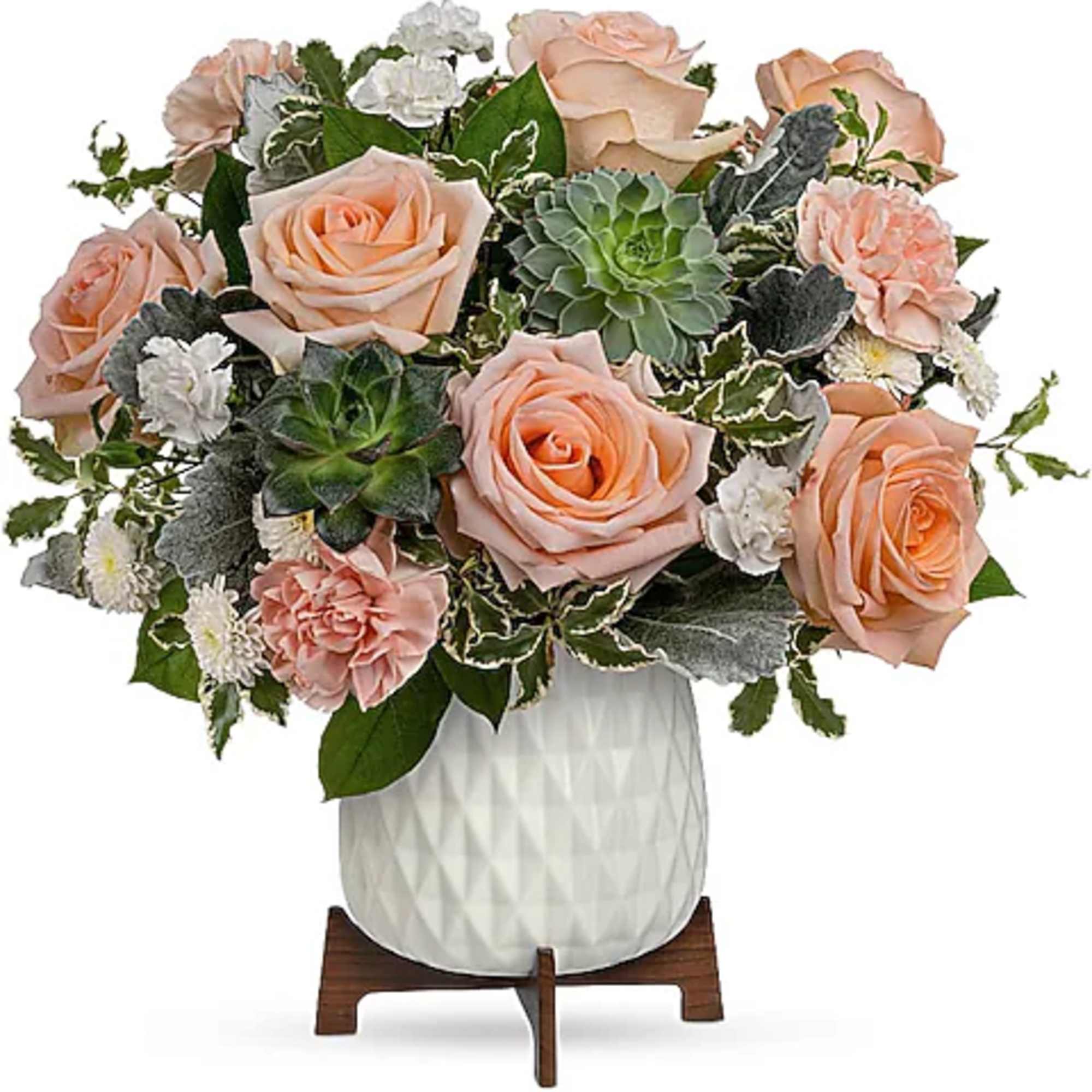 Peach roses and succulents arranged in a white vase