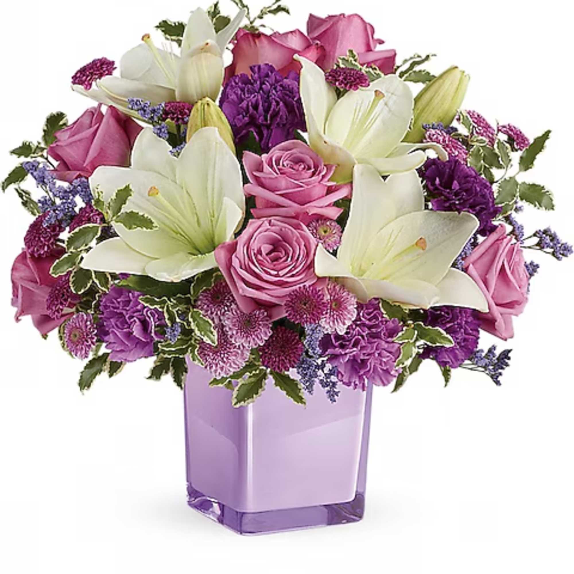 Pink roses and white lilies arranged in a purple vase