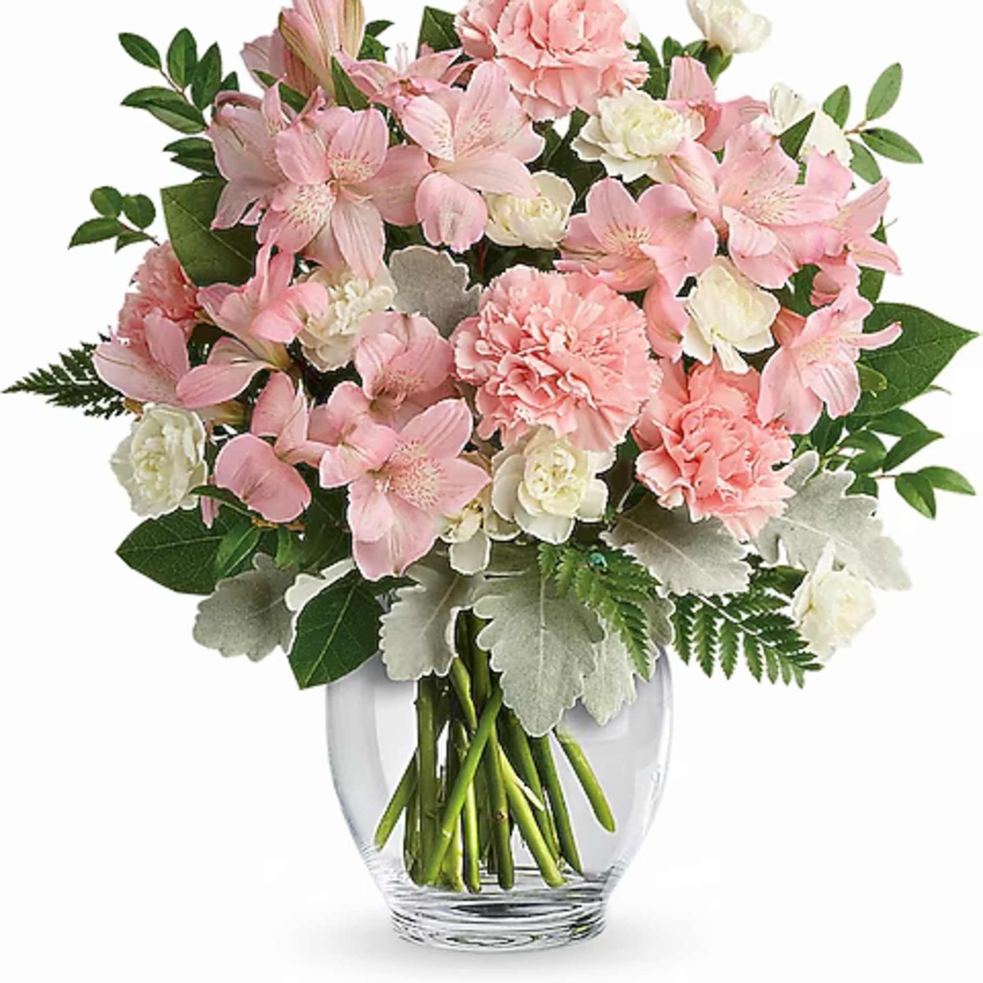 Pink and white bouquet of carnations and lilies in a clear glass vase