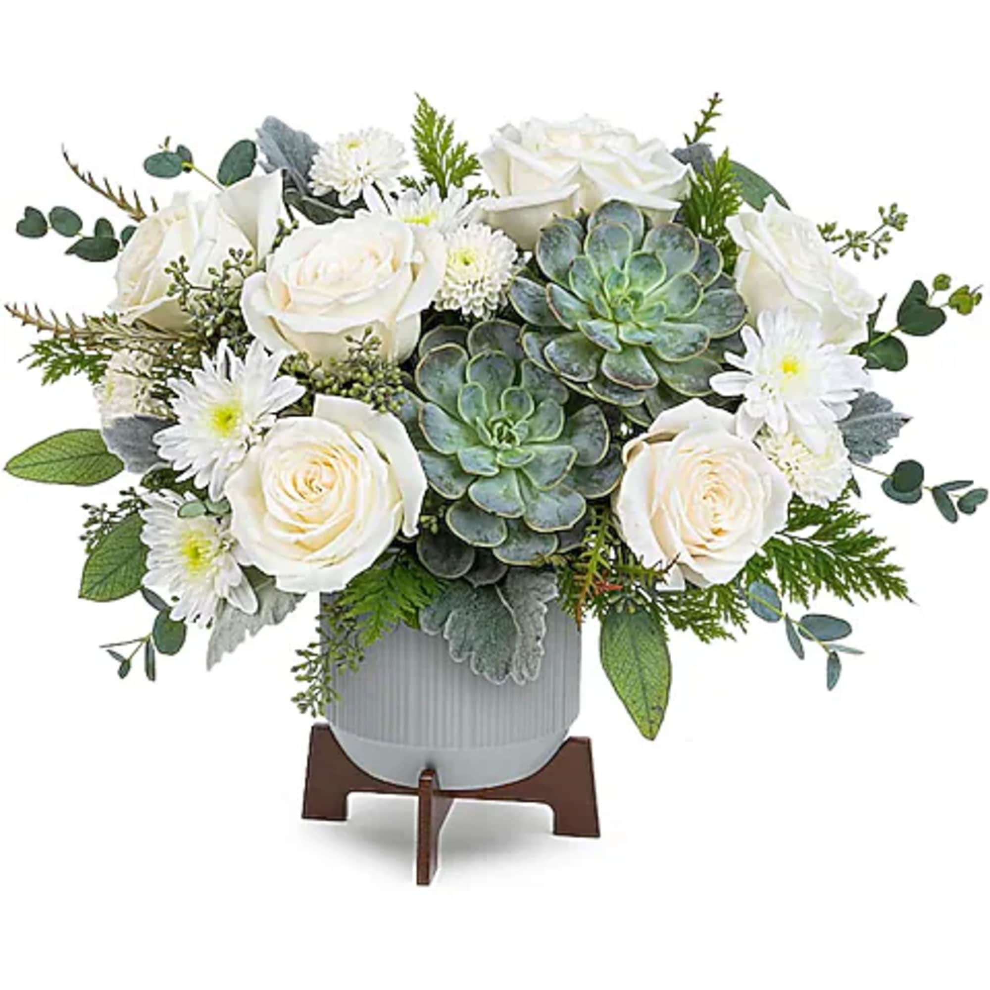 White roses and daisies arranged with succulents in a gray vase