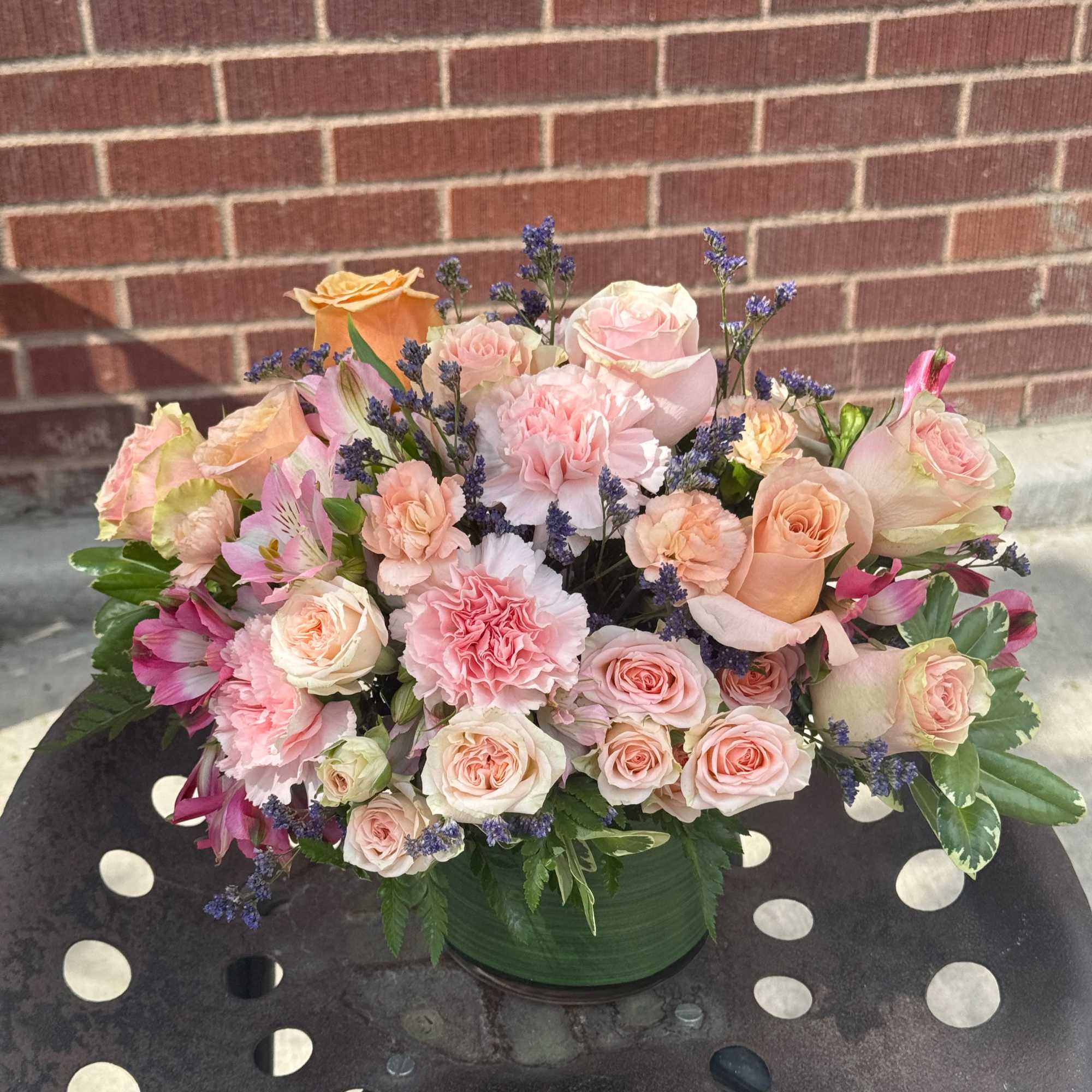 Designed by the owner of the shop, this soft arrangement  features