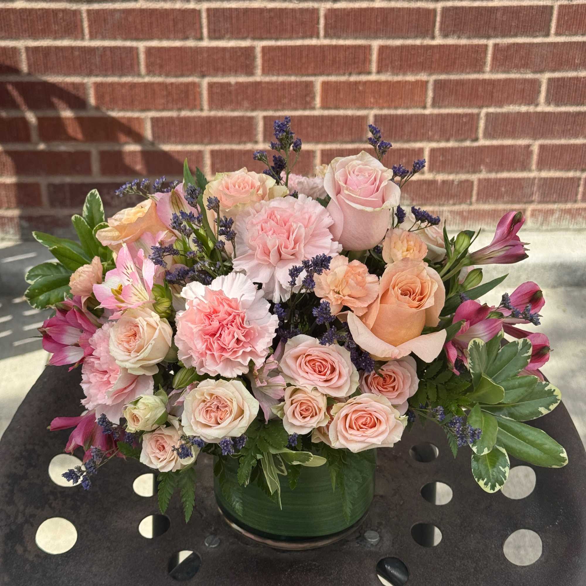 Designed by the owner of the shop, this soft arrangement  features