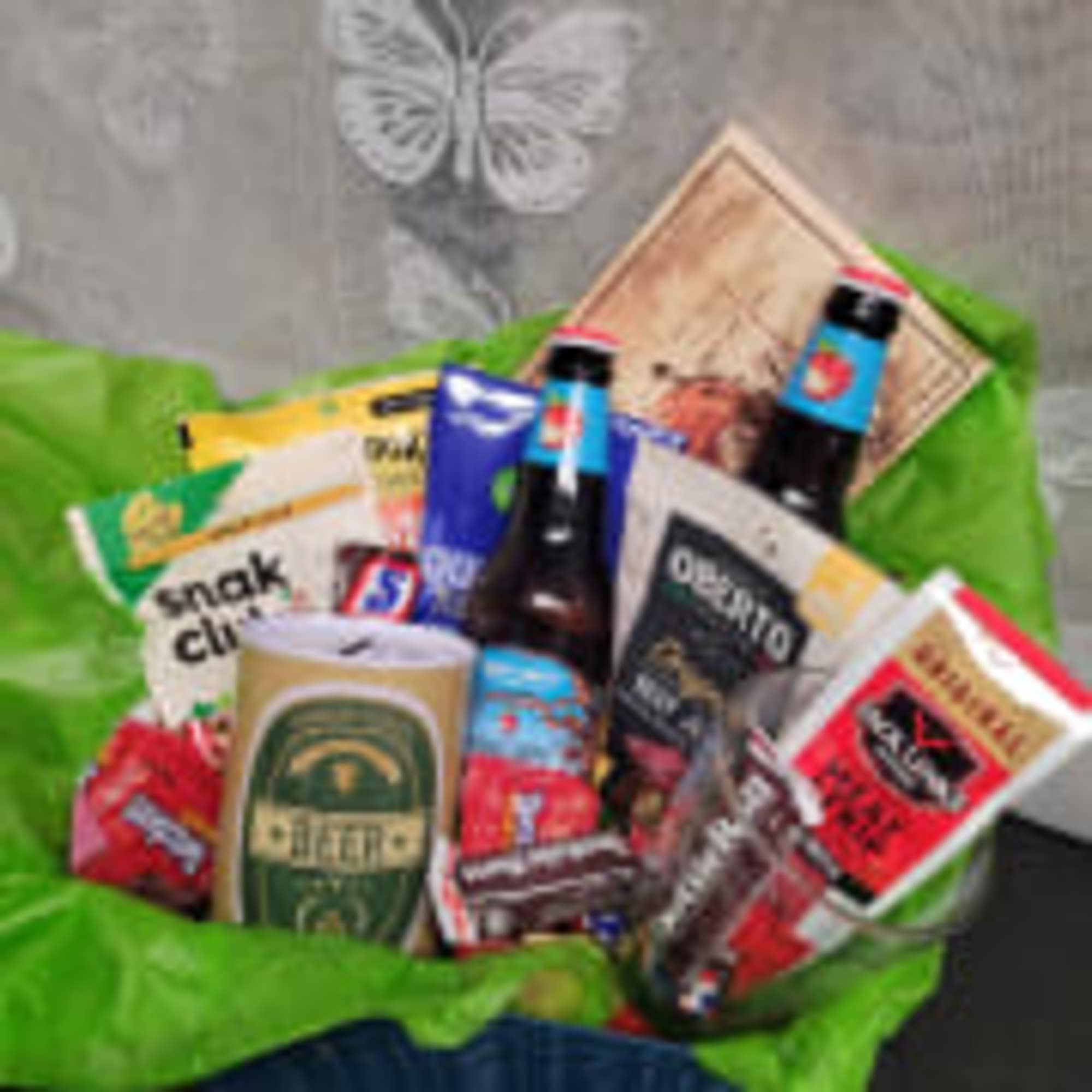 Gift basket with beer bottles and assorted snack packages
