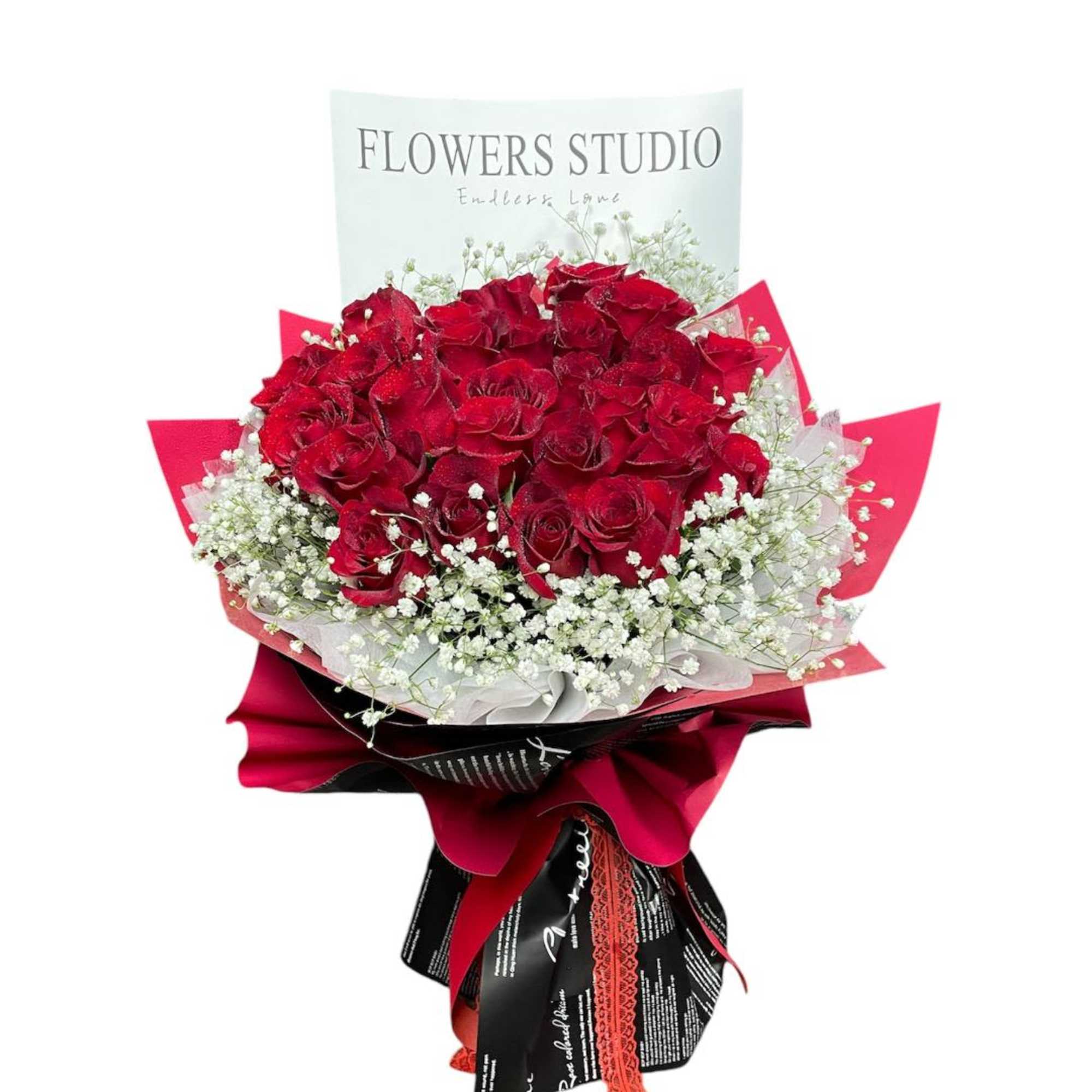 Bouquet of red roses with white baby's breath and red wrapping