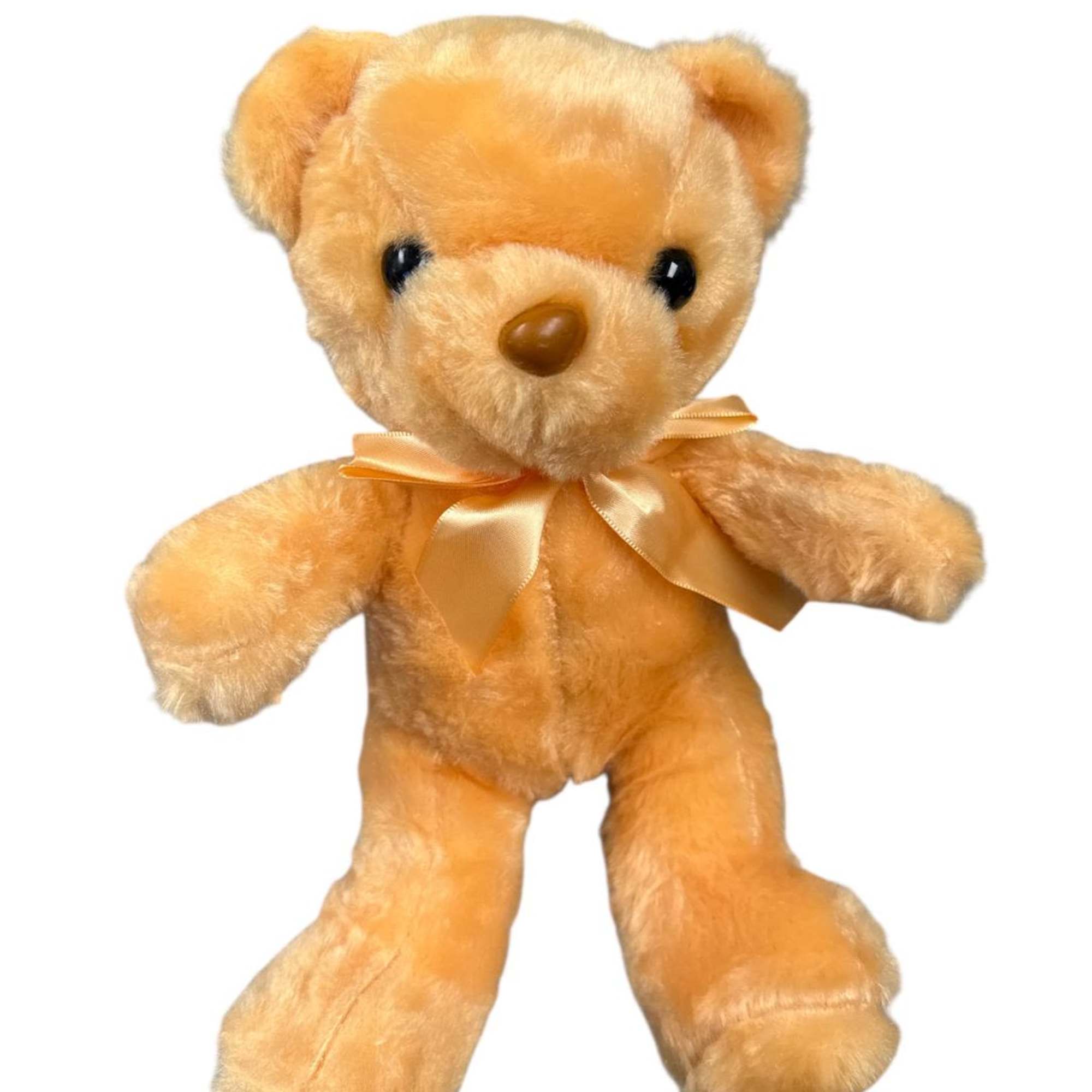 Golden teddy bear with a satin ribbon bow