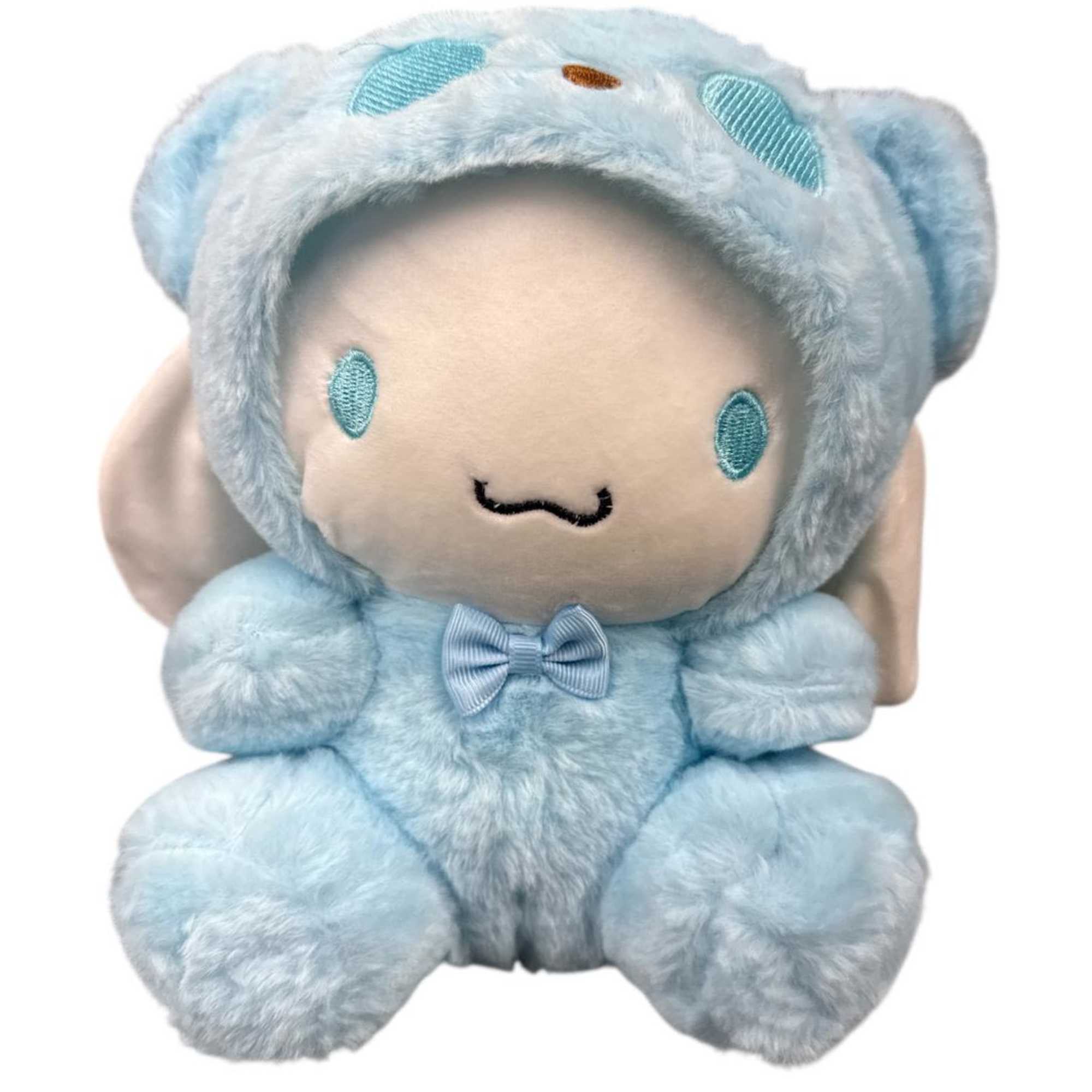 Blue plush teddy bear with a bow on a white background