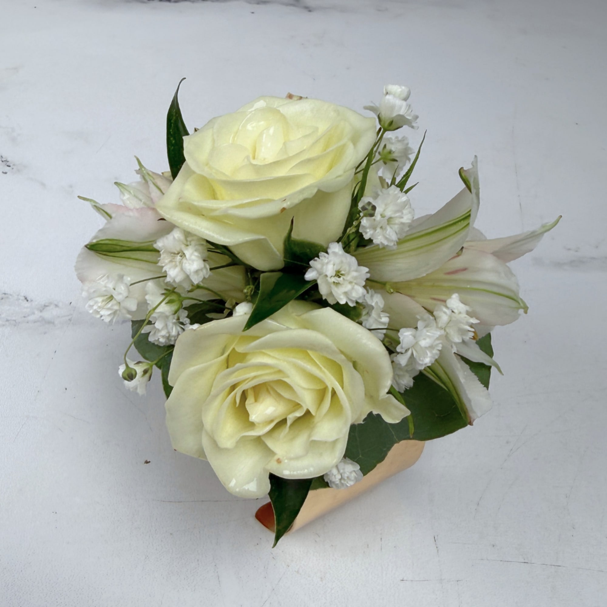 The Elegant Ivory Corsage features four white/ivory spray roses and two alstroemeria, photo 3 of 4