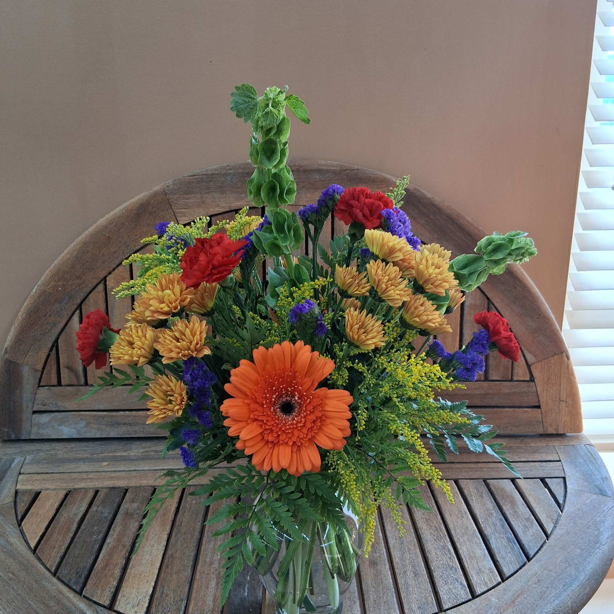 Fall colored flowers ina vase., photo 2 of 2