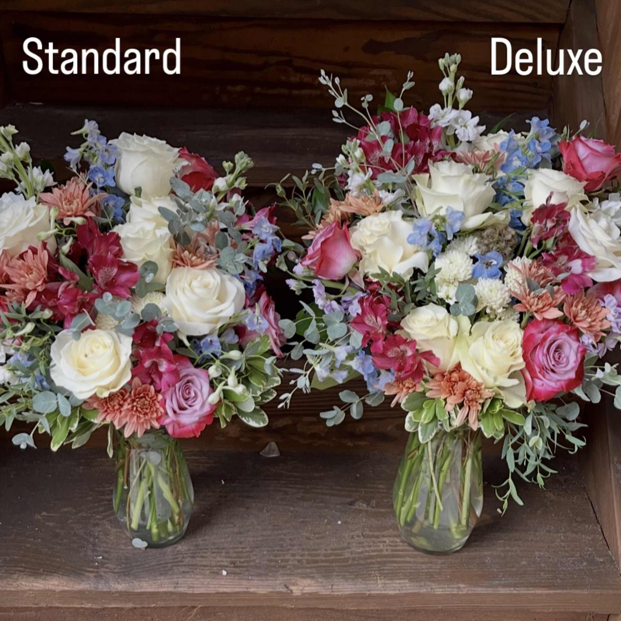 Two mixed flower bouquets in glass vases, labeled Standard and Deluxe